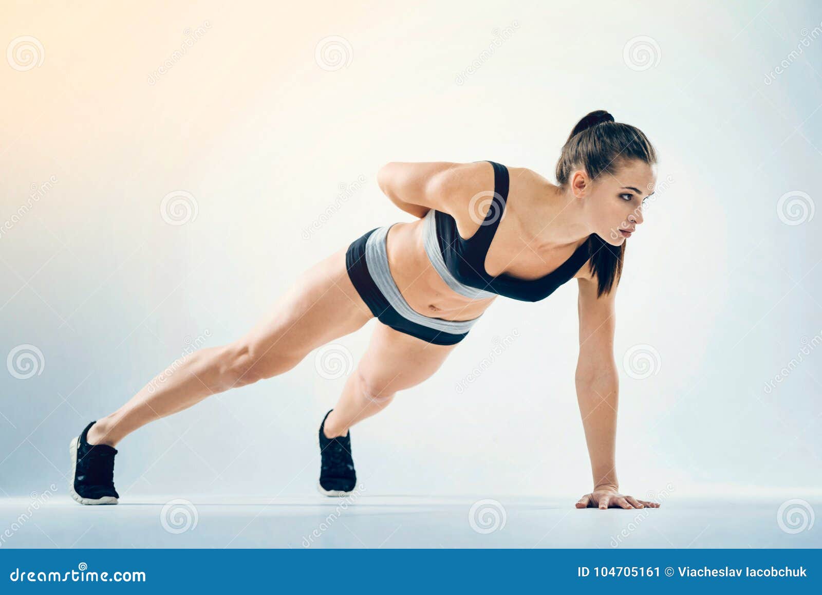 Motivated Young Woman Doing One Arm Pushup Stock Image - Image of