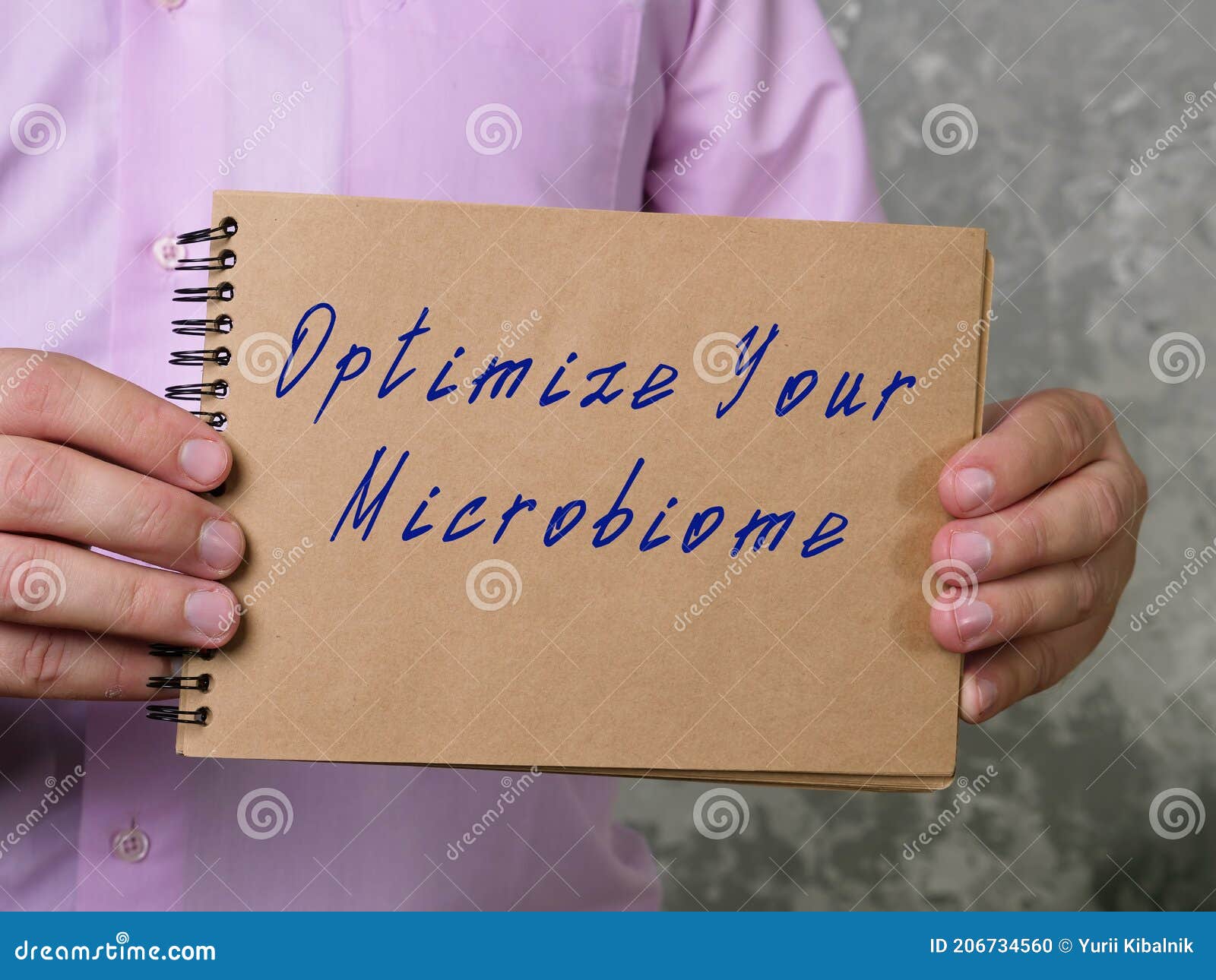 motivational concept about optimize your microbiome with sign on the piece of paper