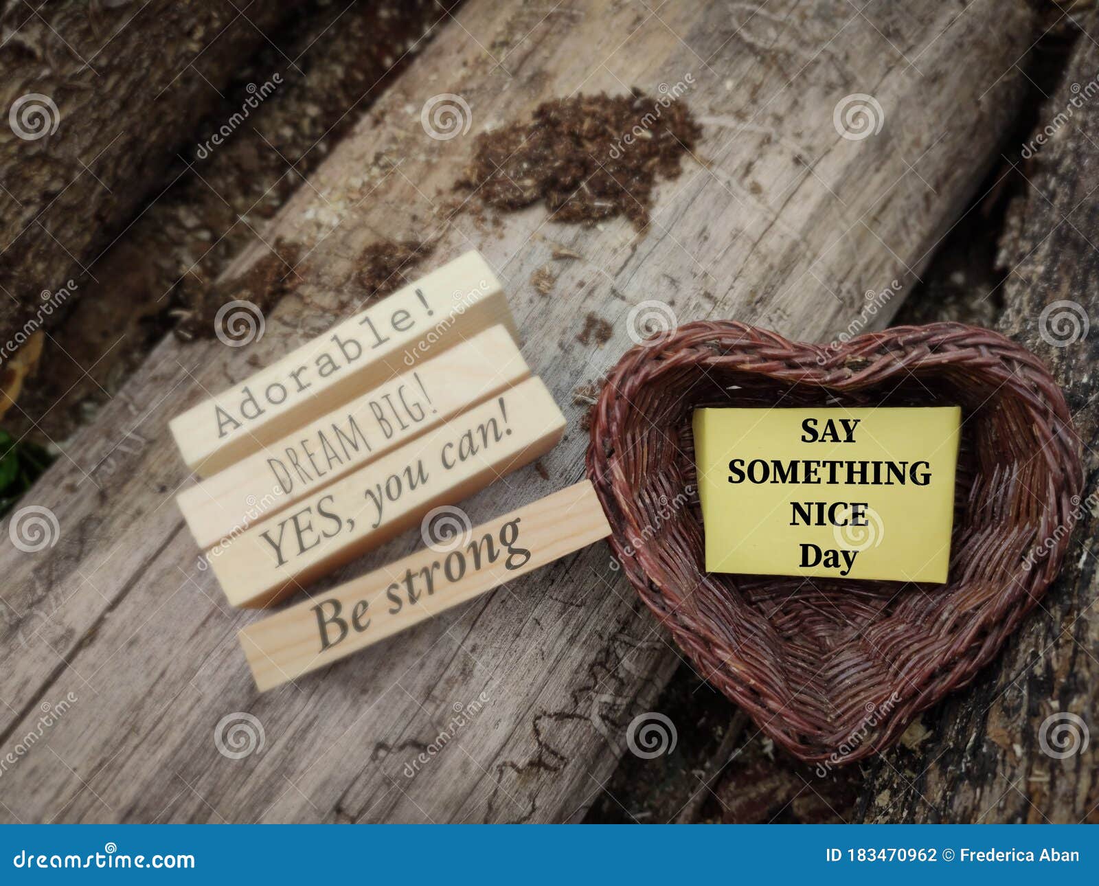 motivational and inspirational celebration concept - say something nice day text on notepaper inside heart d basket