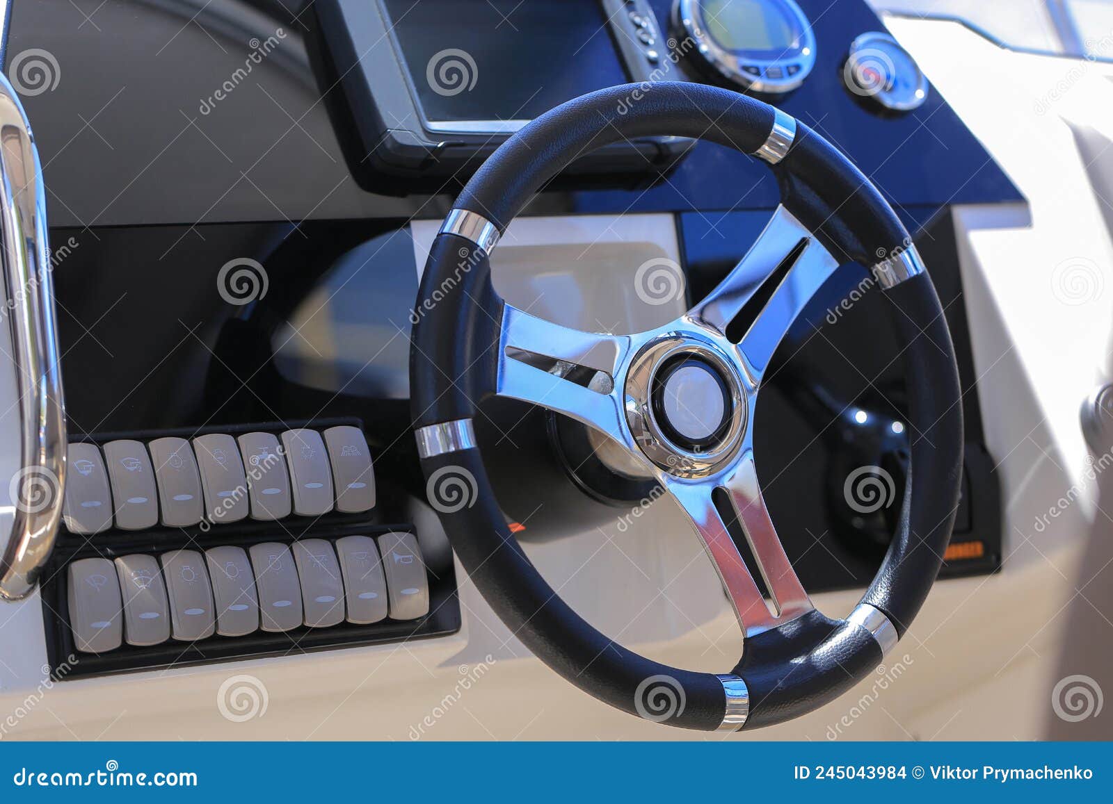 Motor Boat Steering Wheel and Dashboard with Navigation Devices Stock