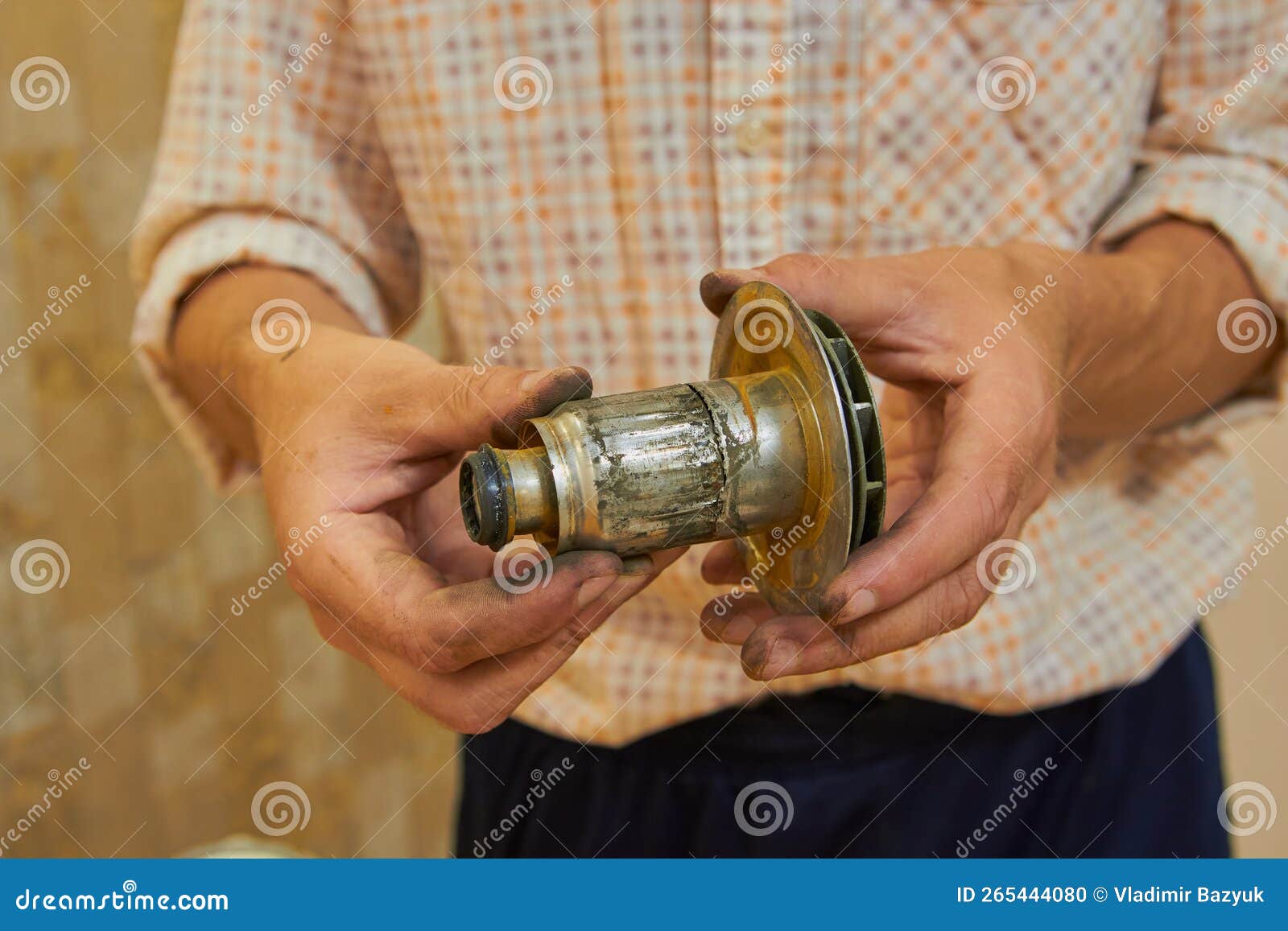 Motor Rotor is Broken,the Locksmith Holds in His Hands the Damaged