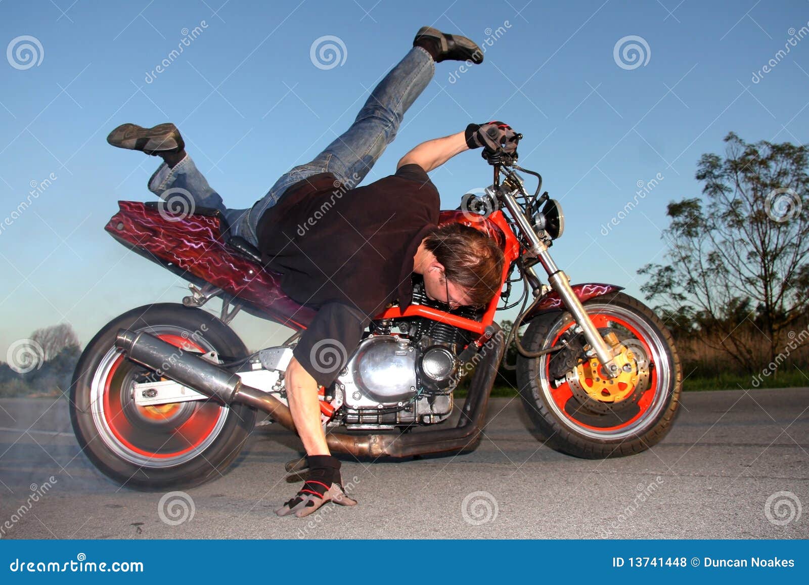 Motorbike Stunt stock photo. Image of racing, action 13741448