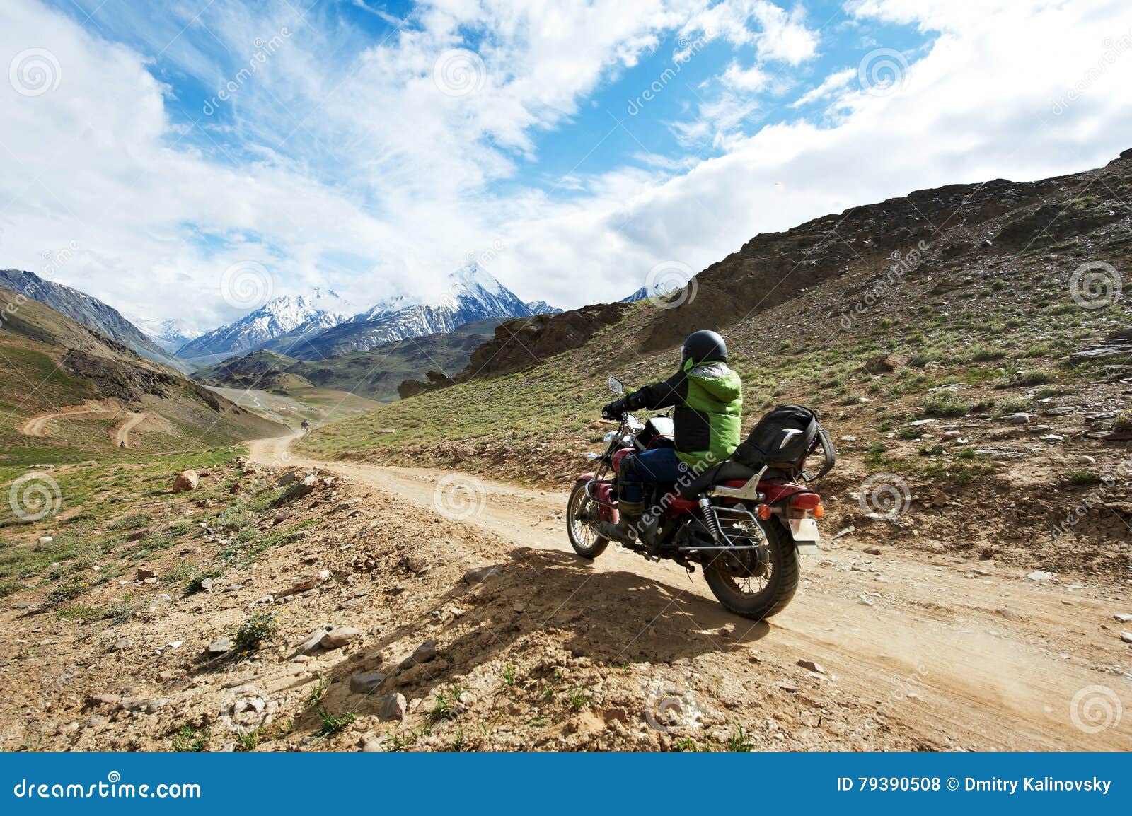 Motorbike Tourism. Traveller at Motorcycle in Mountains Stock Photo
