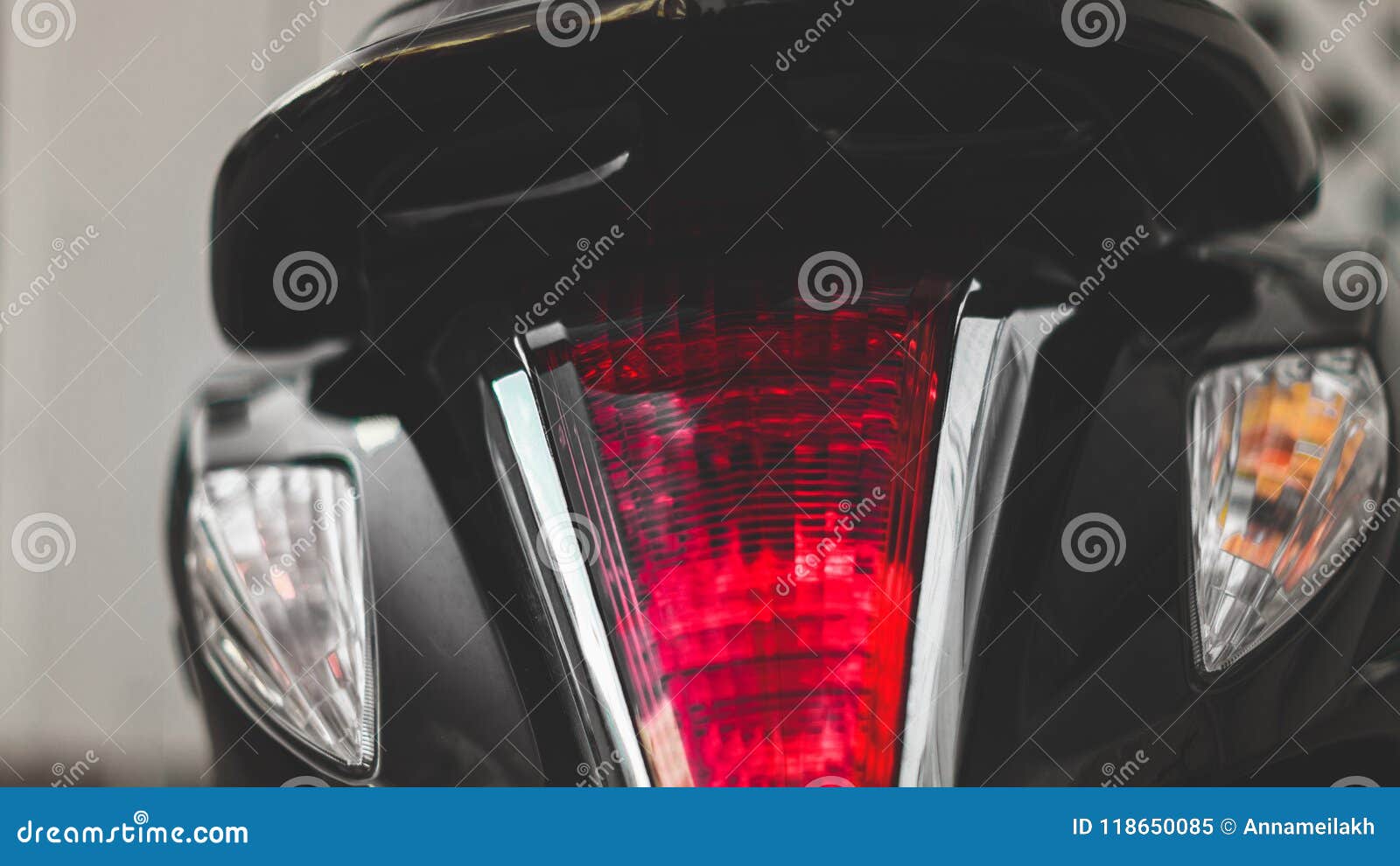 motorcicle tail lights on a street.