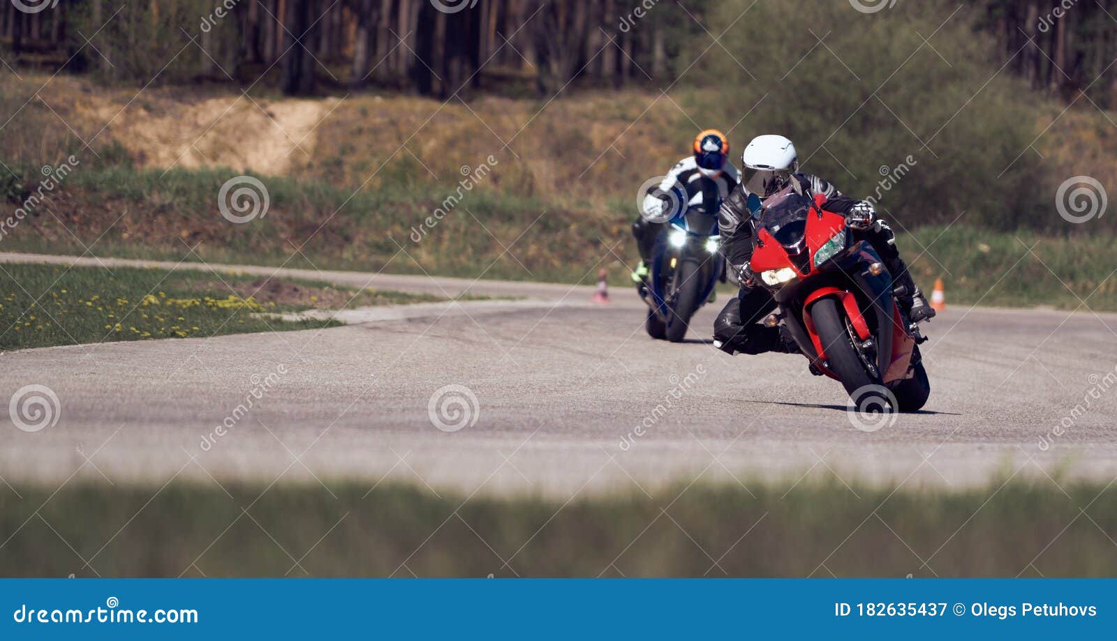 Motorcycle Practice Leaning into a Fast Corner on Track Stock Image