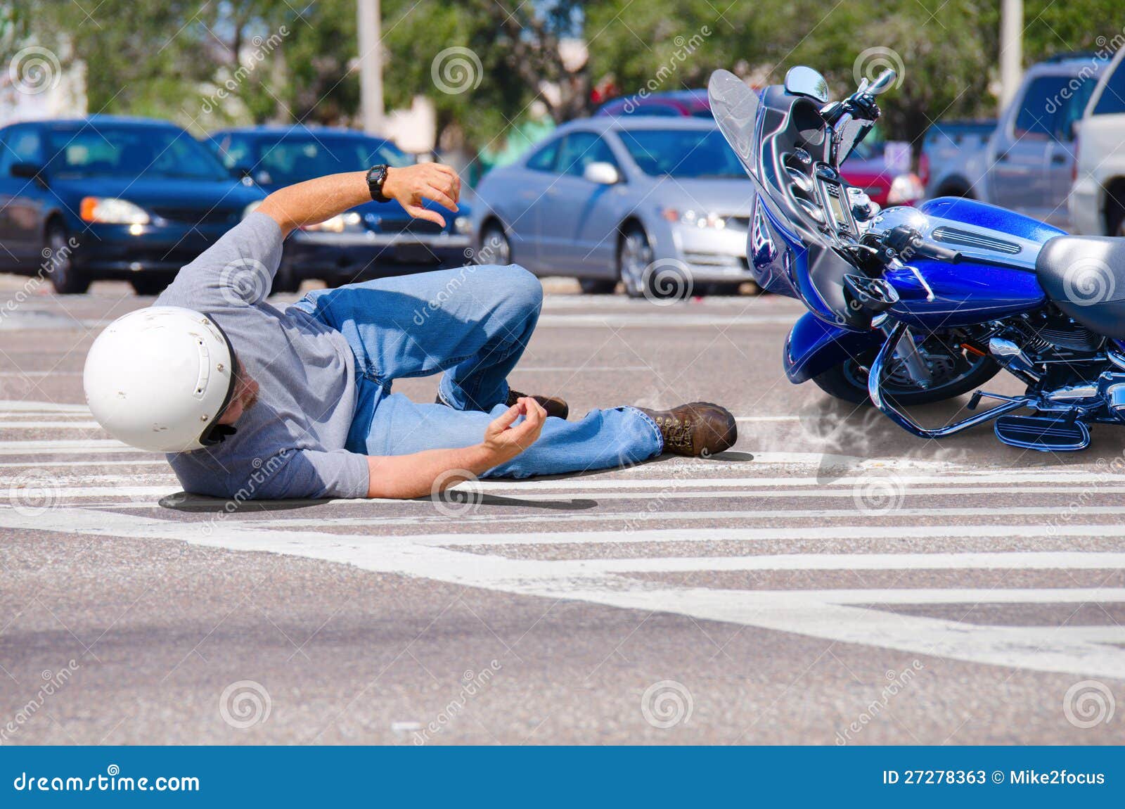 motorcycle wreck at a busy intersection