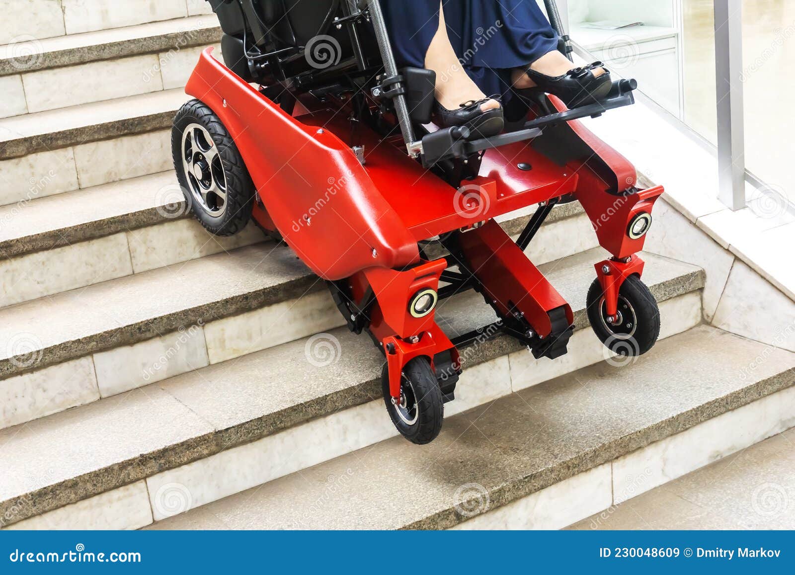A Motorized Wheelchair Climbs the Stairs. Modern Development of