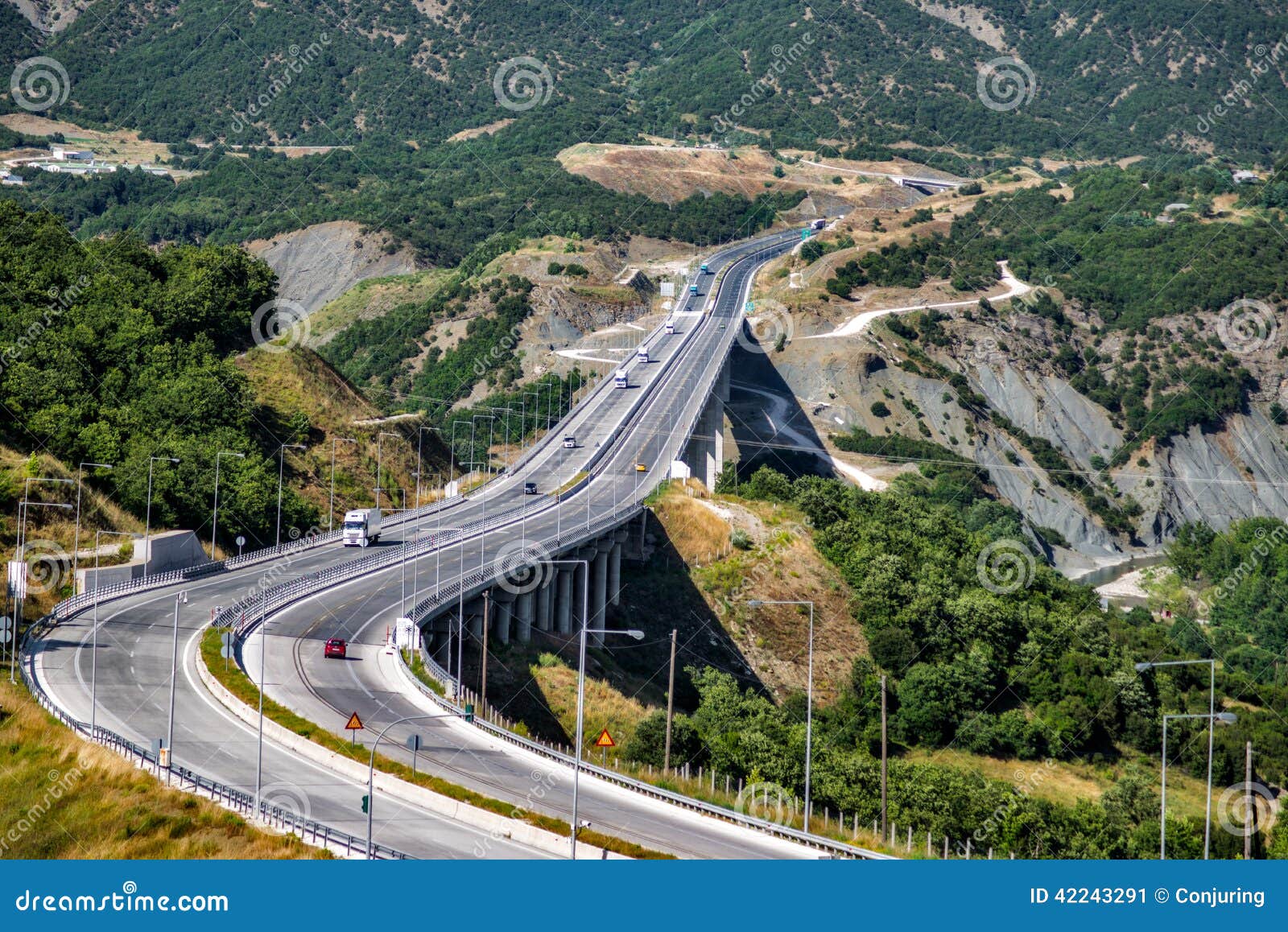 Motorway traffic. Traffic passing through a motorway bridge