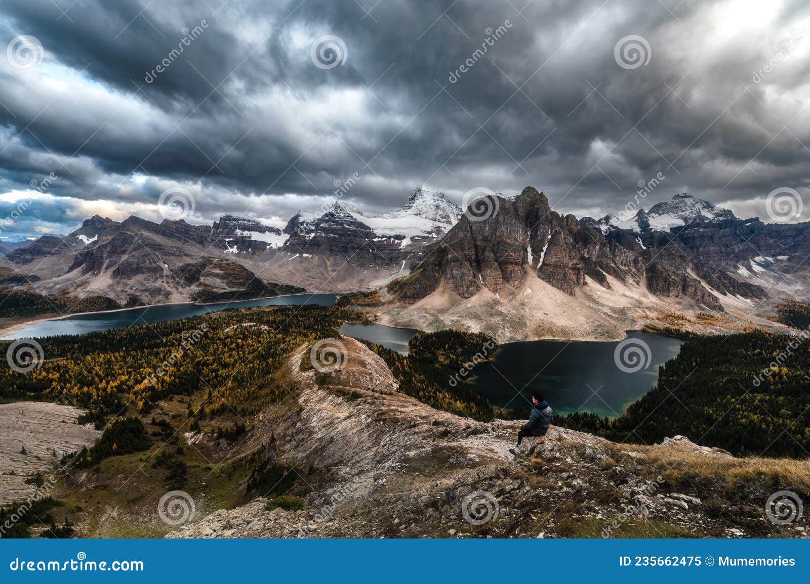 mount assiniboine with dramatic sky on nublet peak in provincial park