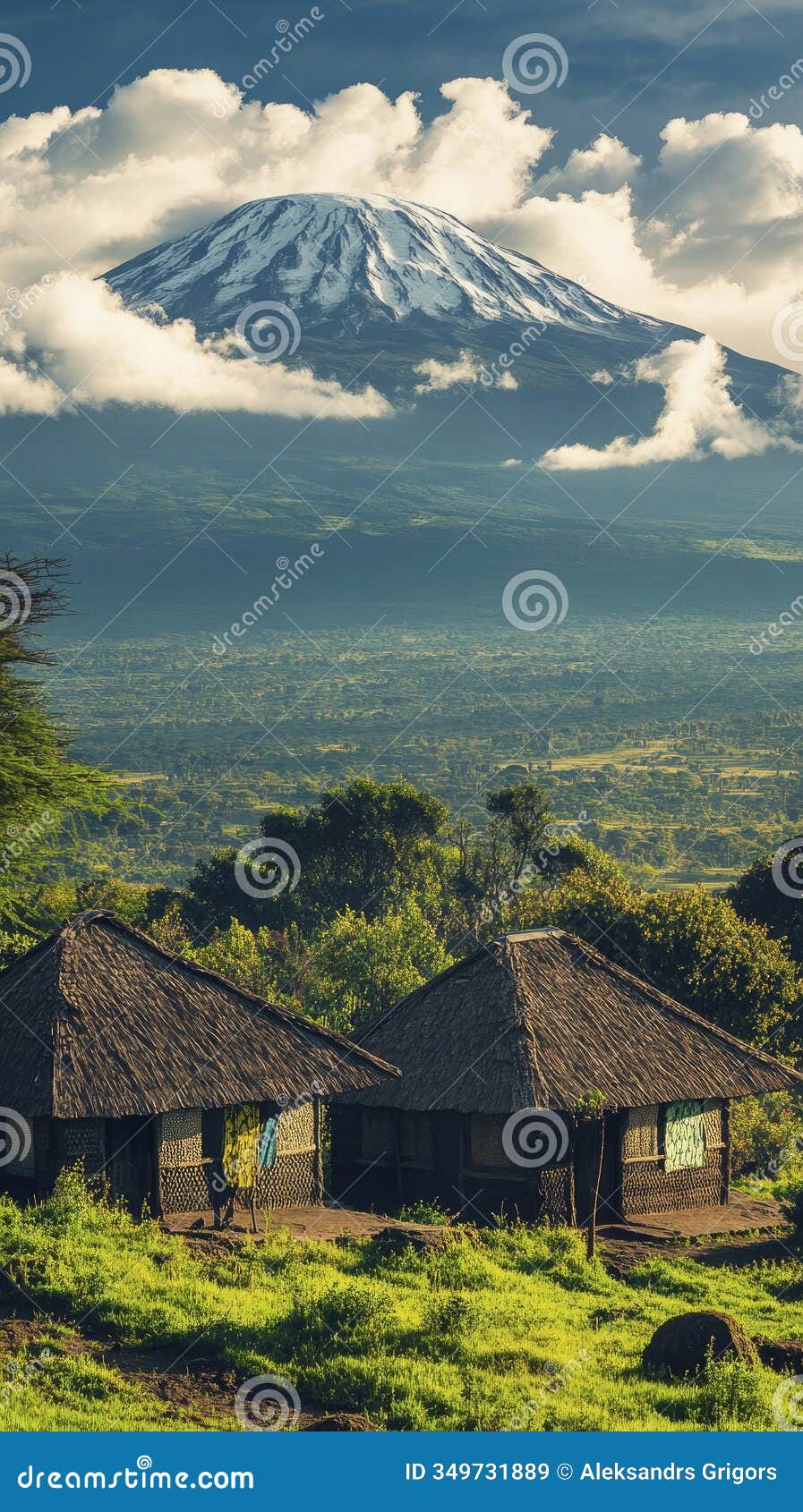 mount kilimanjaro with a snowy peak, surrounded by vast green landscapes, traditional african huts