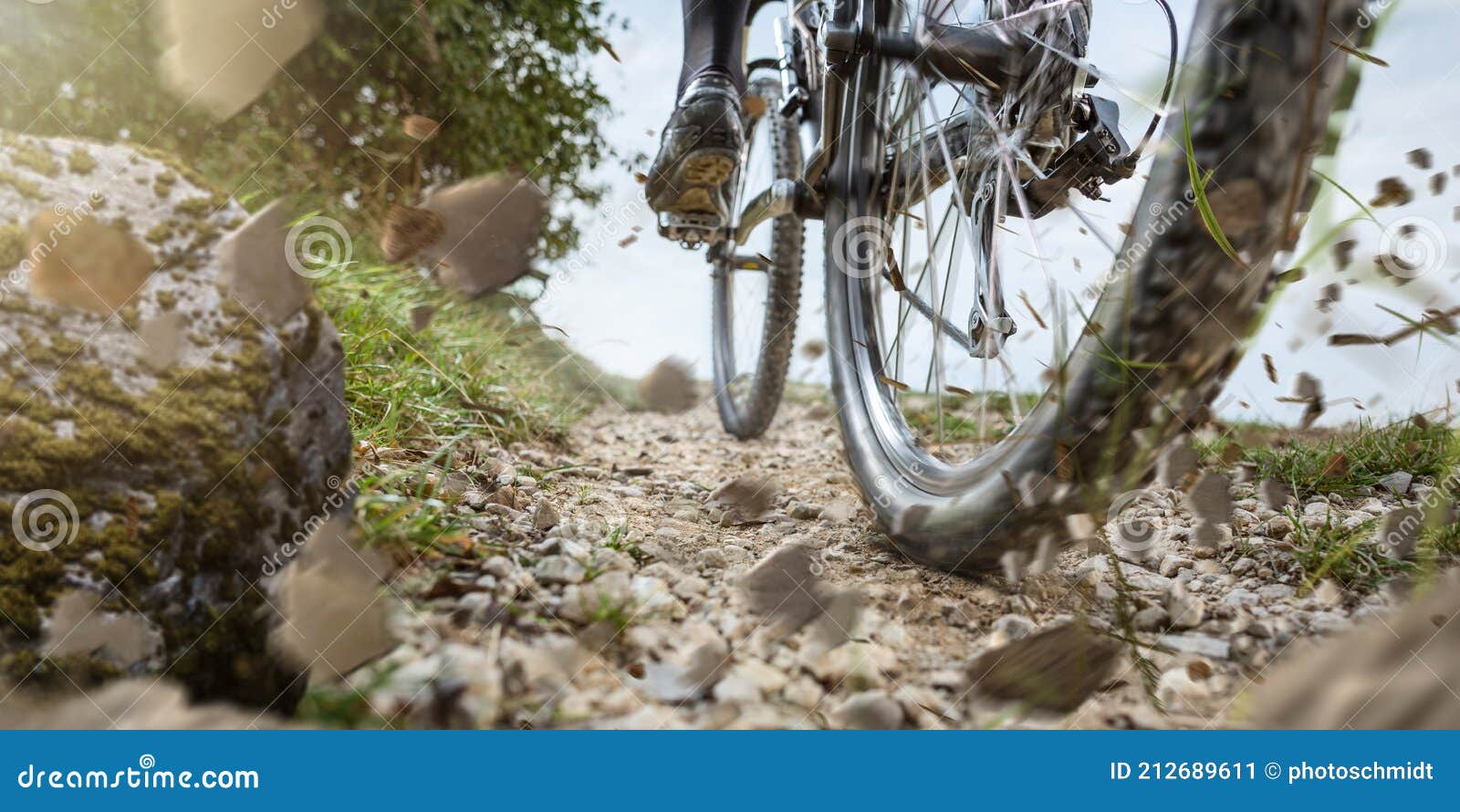 mountain bike wheel on a gravel track