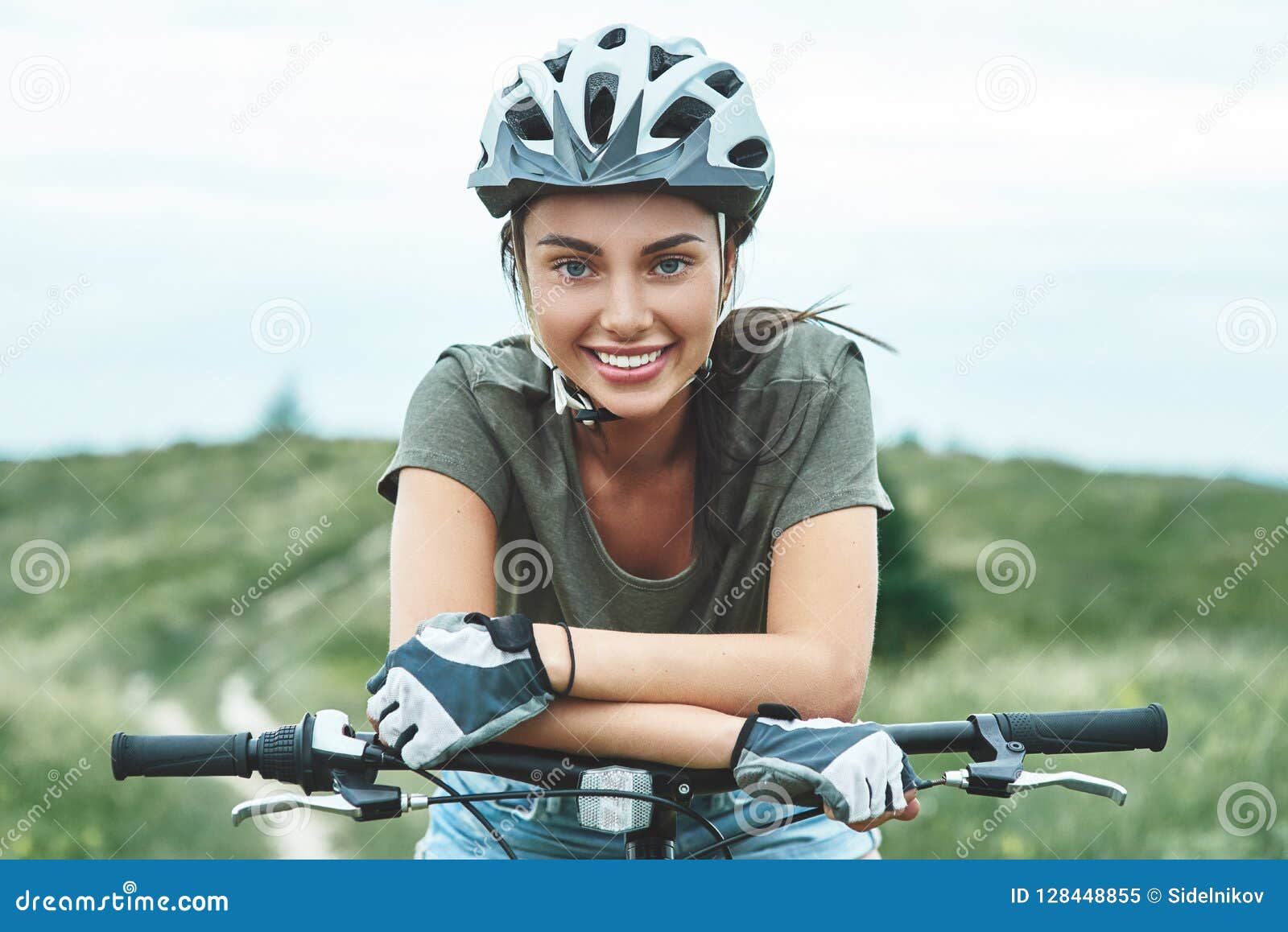 mountain biking - woman with fatbike enjoys summer vacation. close up