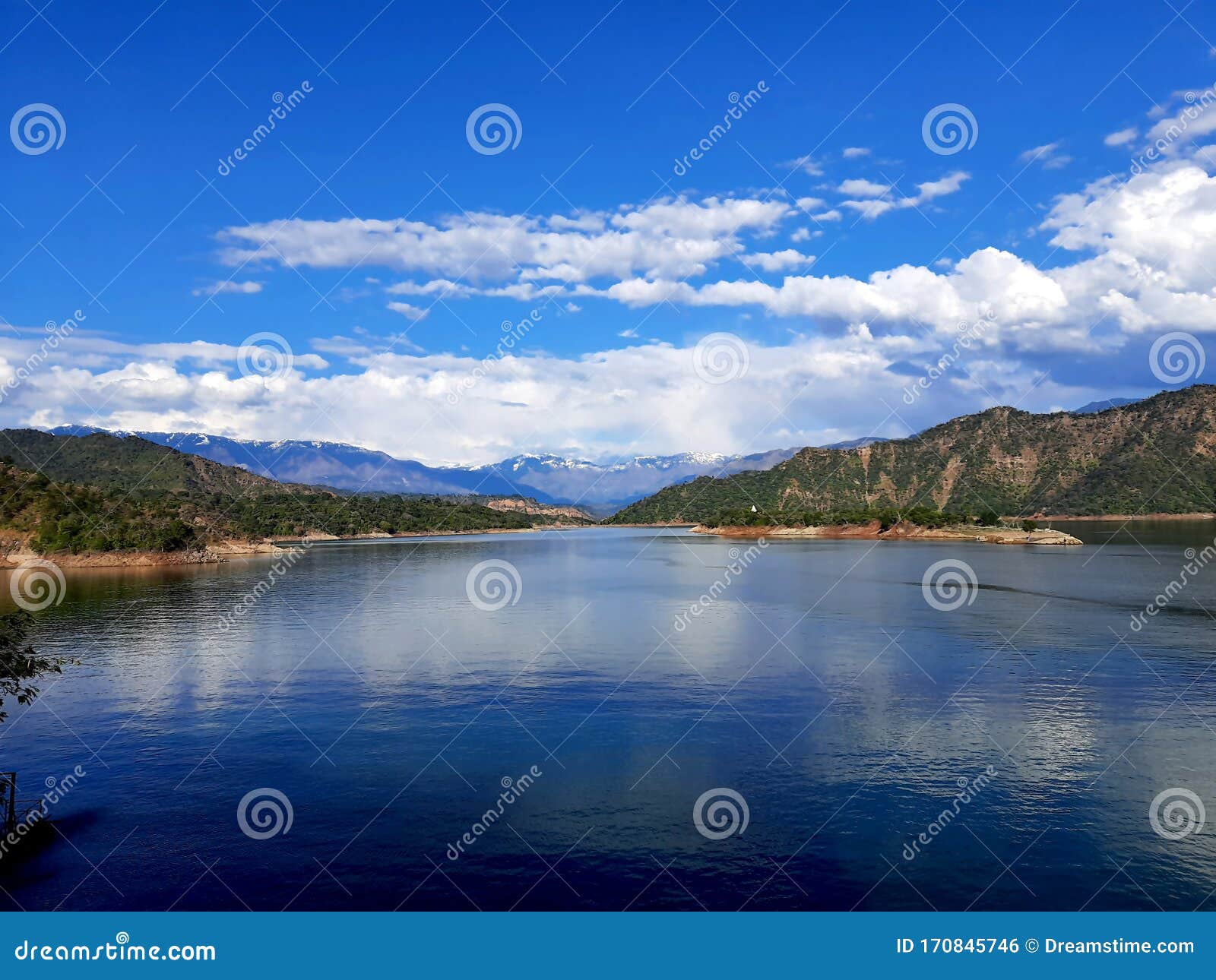 Mountain and Blue Sky Reflection in Water or Lake at Dalhousie Stock