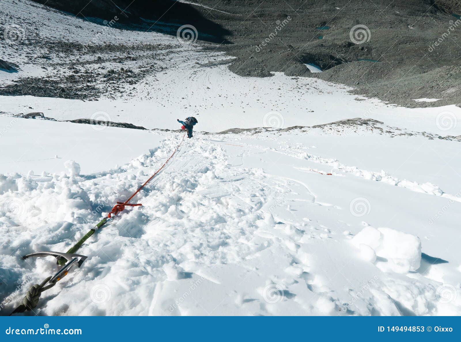 Mountain Climber Going Down the Vertical Wall. Climbing Equipment