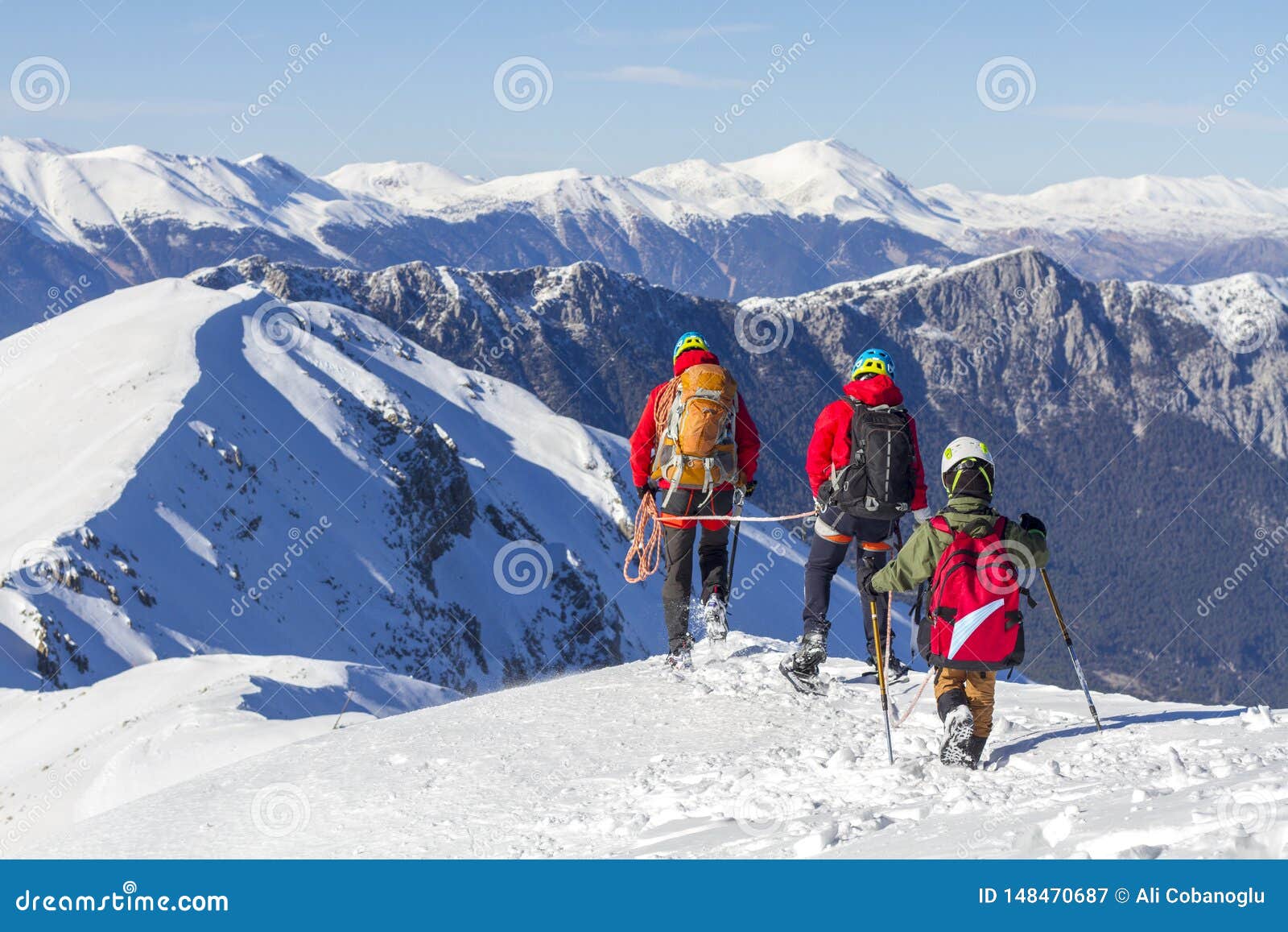 3 Mountain Climbers Walk on Snow in the Mountains Stock Image Image