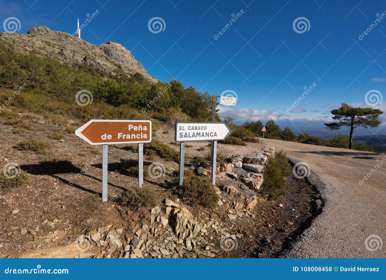mountain landscape, road sign indication to pena de francia, salamanca, spain.