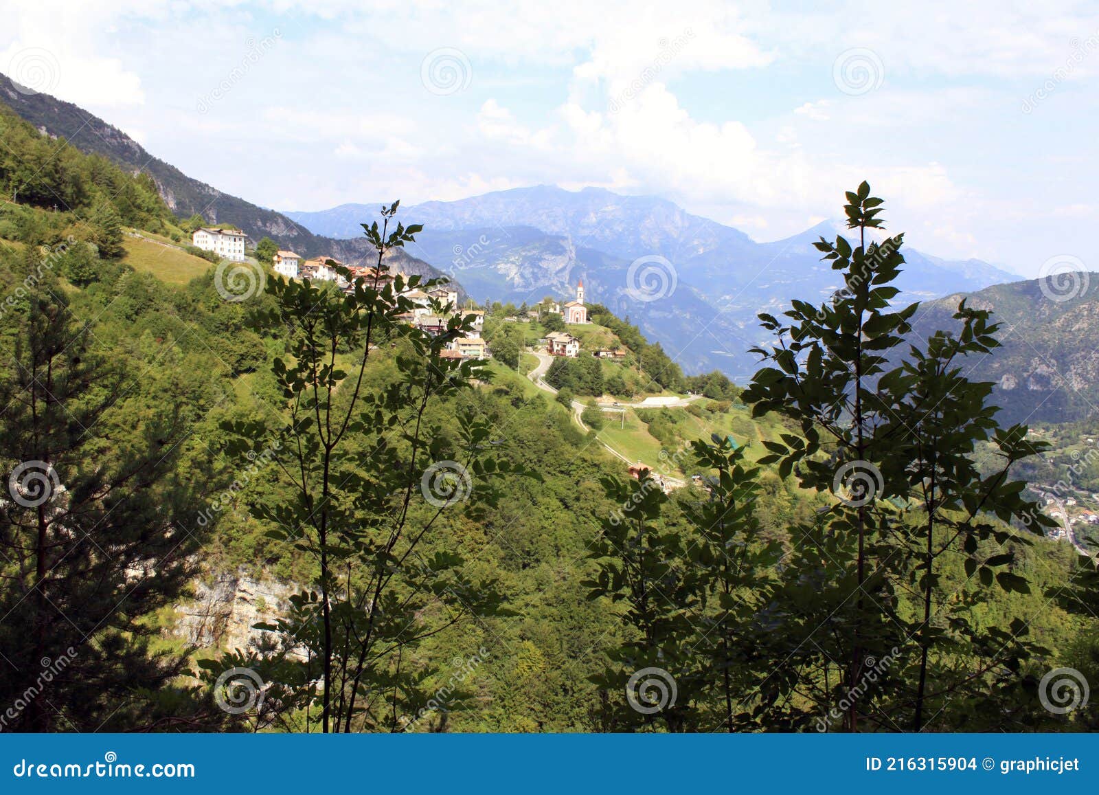 mountain landscape with the town of guardia, trentino, italy