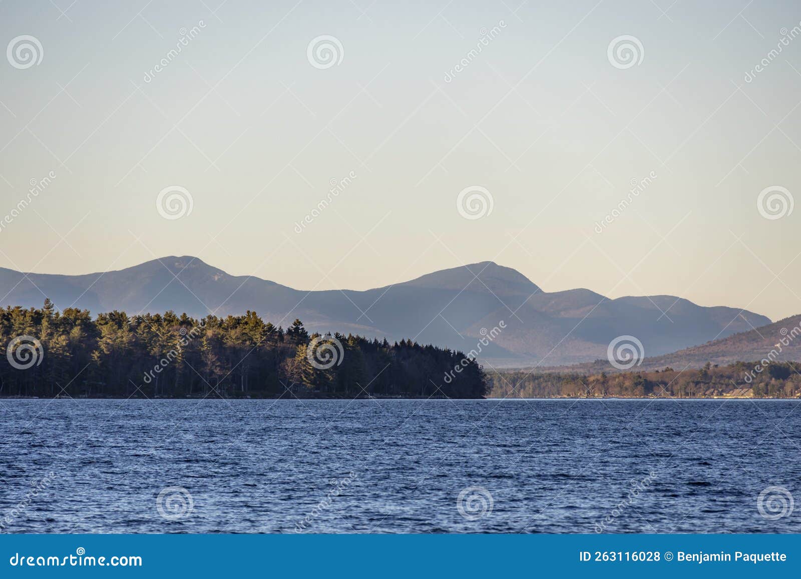 Mountain Peaks in the Distance Behind a Lake in the Fall Stock Photo