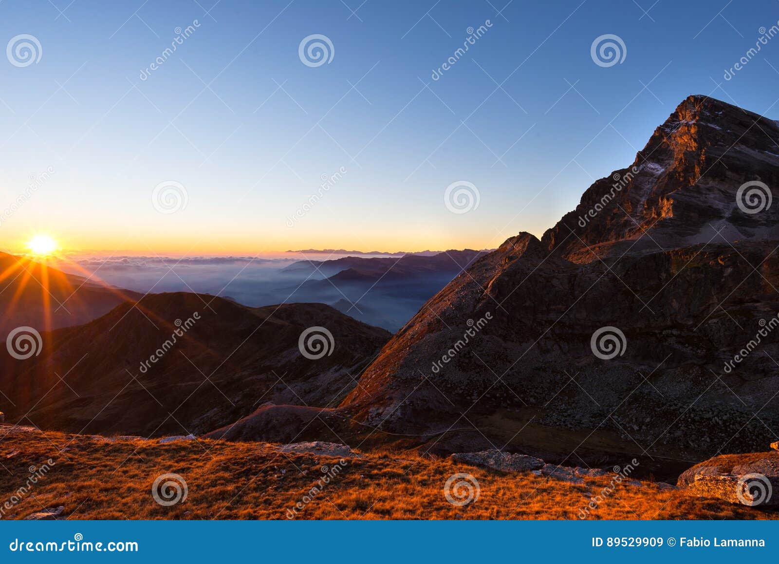 Mountain Range at Sunset, Backlight with Sunburst, Italian Alps Stock ...