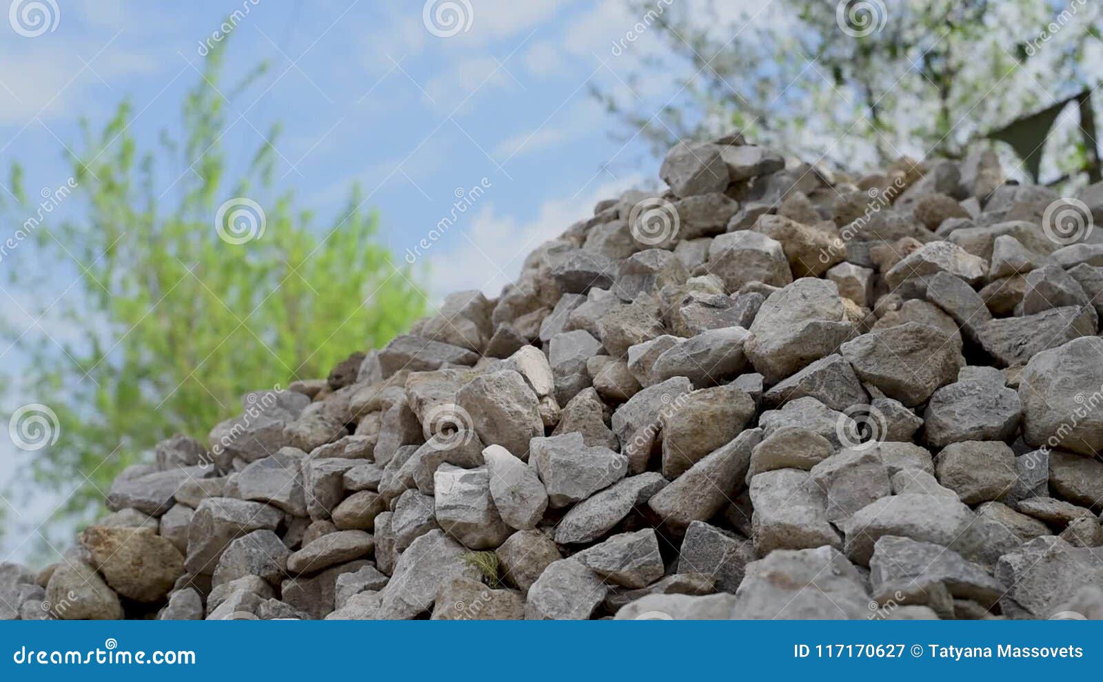 A Mountain of Stones, a Hand Throws Stones on a Hill Stones Roll