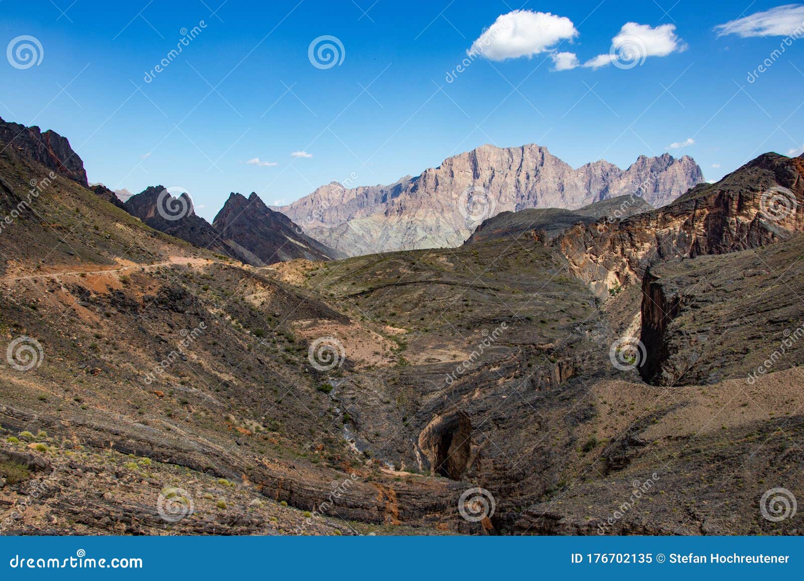 mountain and valley view along wadi sahtan road and snake canyon in al hajir mountains between nizwa and mascat in oman