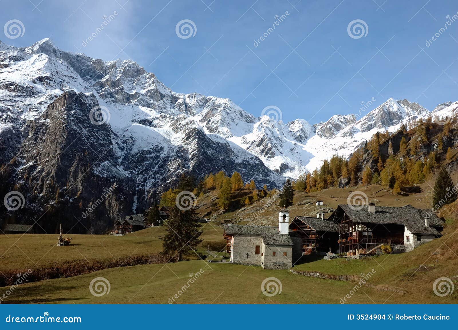 Mountain village during fall season; west Alps, Italy