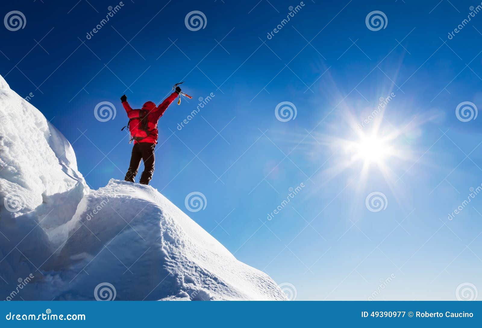 mountaineer celebrates the conquest of the summit.