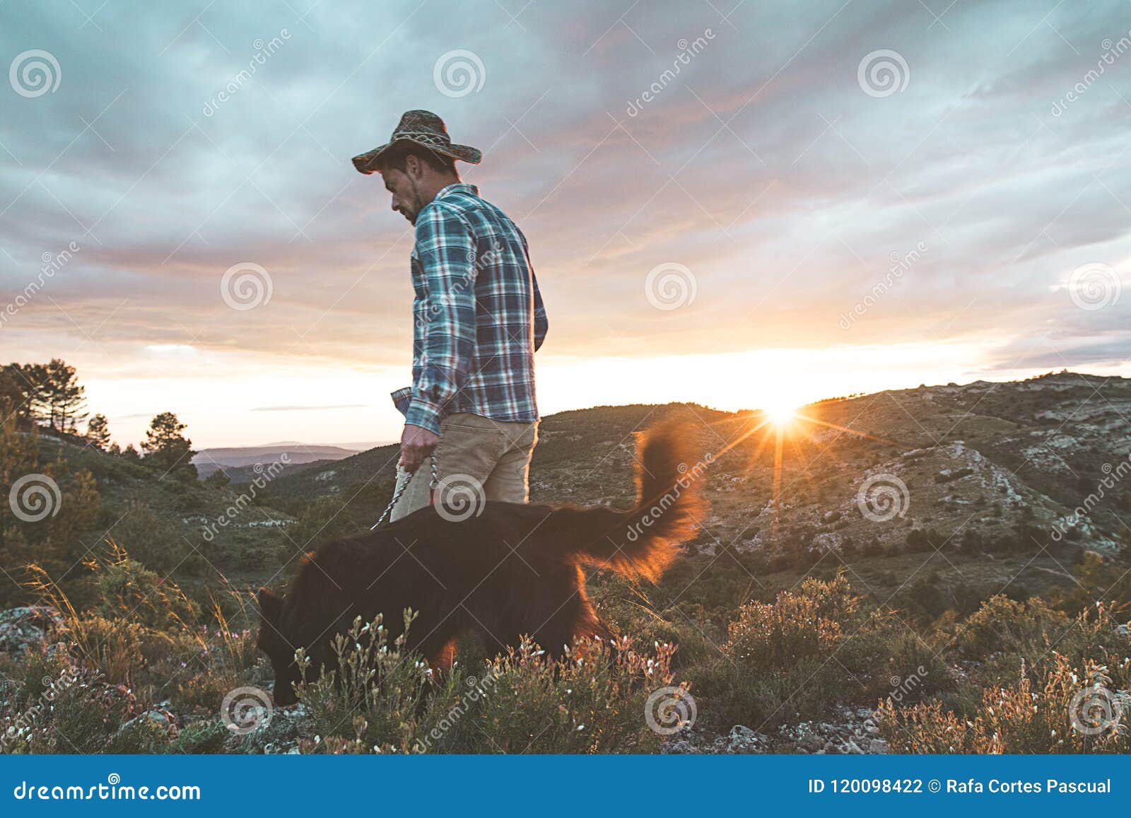 Mountaineer with His Dog in the Mountains Stock Photo Image of rock