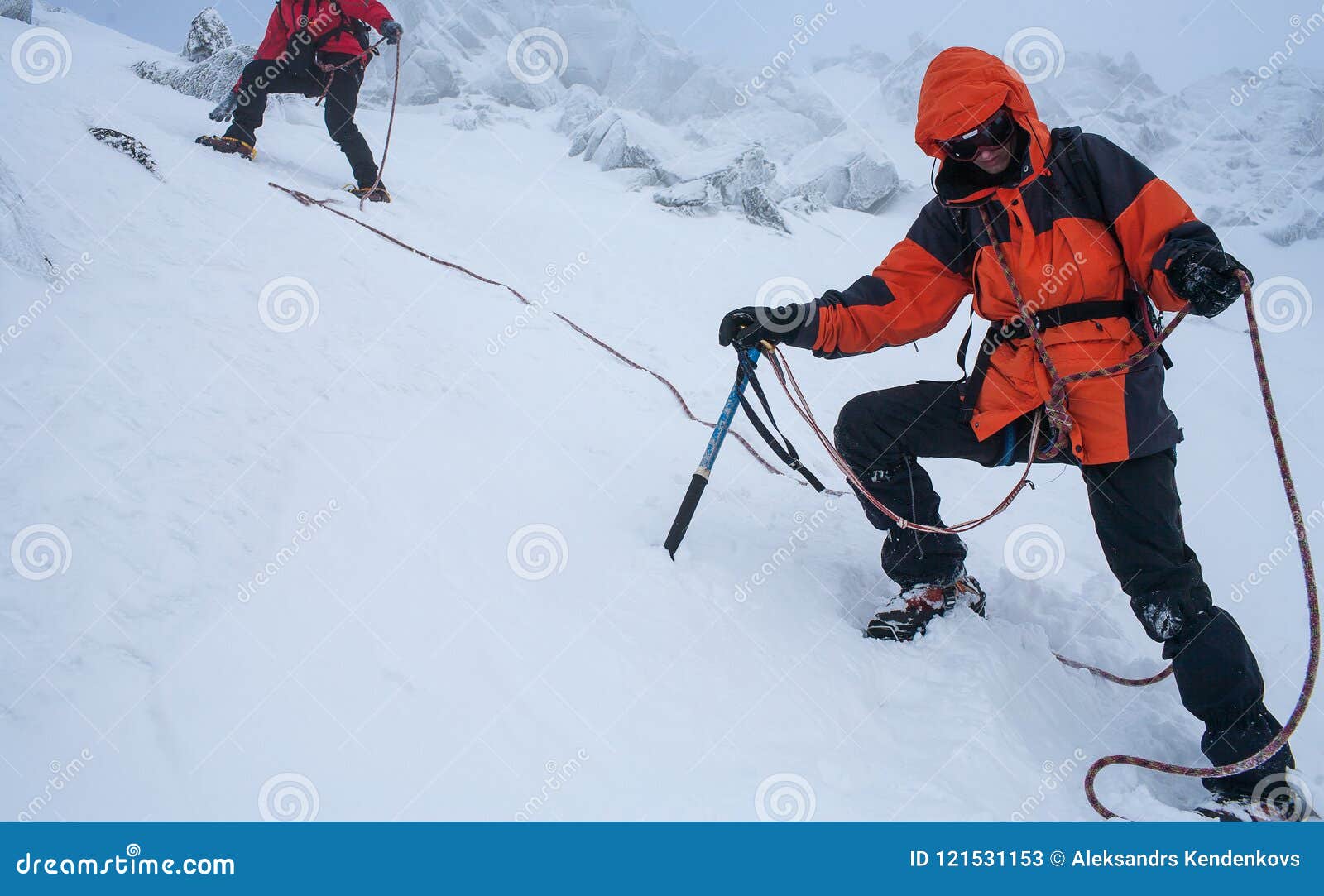 Teamwork in Alpinism. Mountaineering. Traverse of Mountain. Stock Image