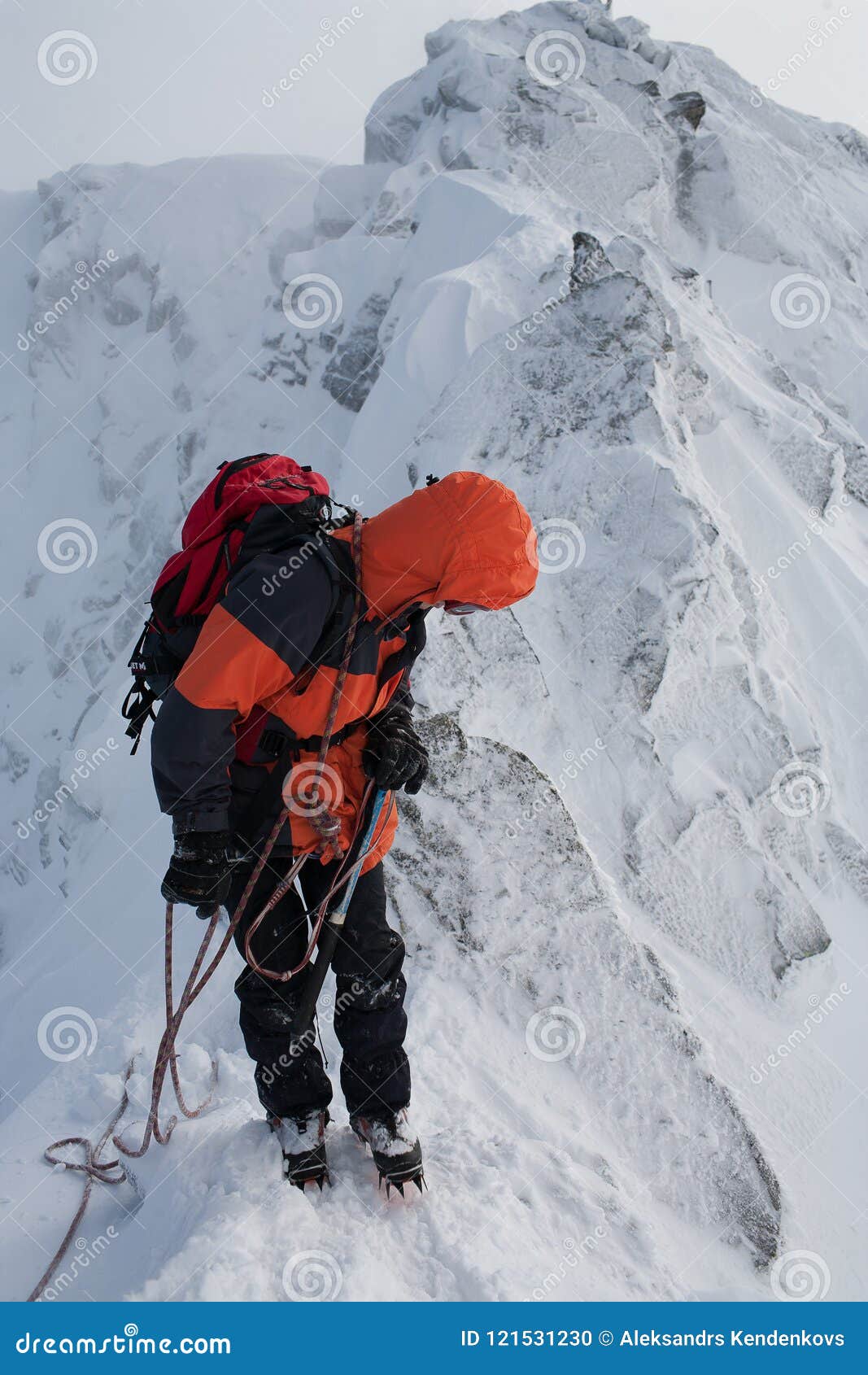 Teamwork in Alpinism. Mountaineering. Traverse of Mountain. Stock Photo