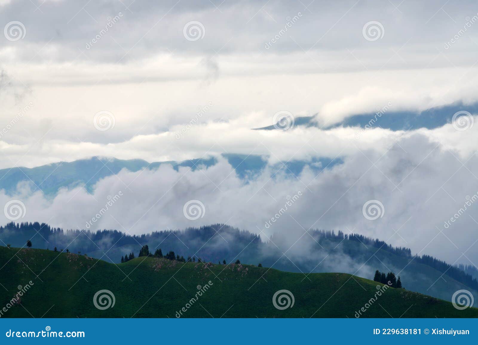 the mountains cloudily in valley grassland