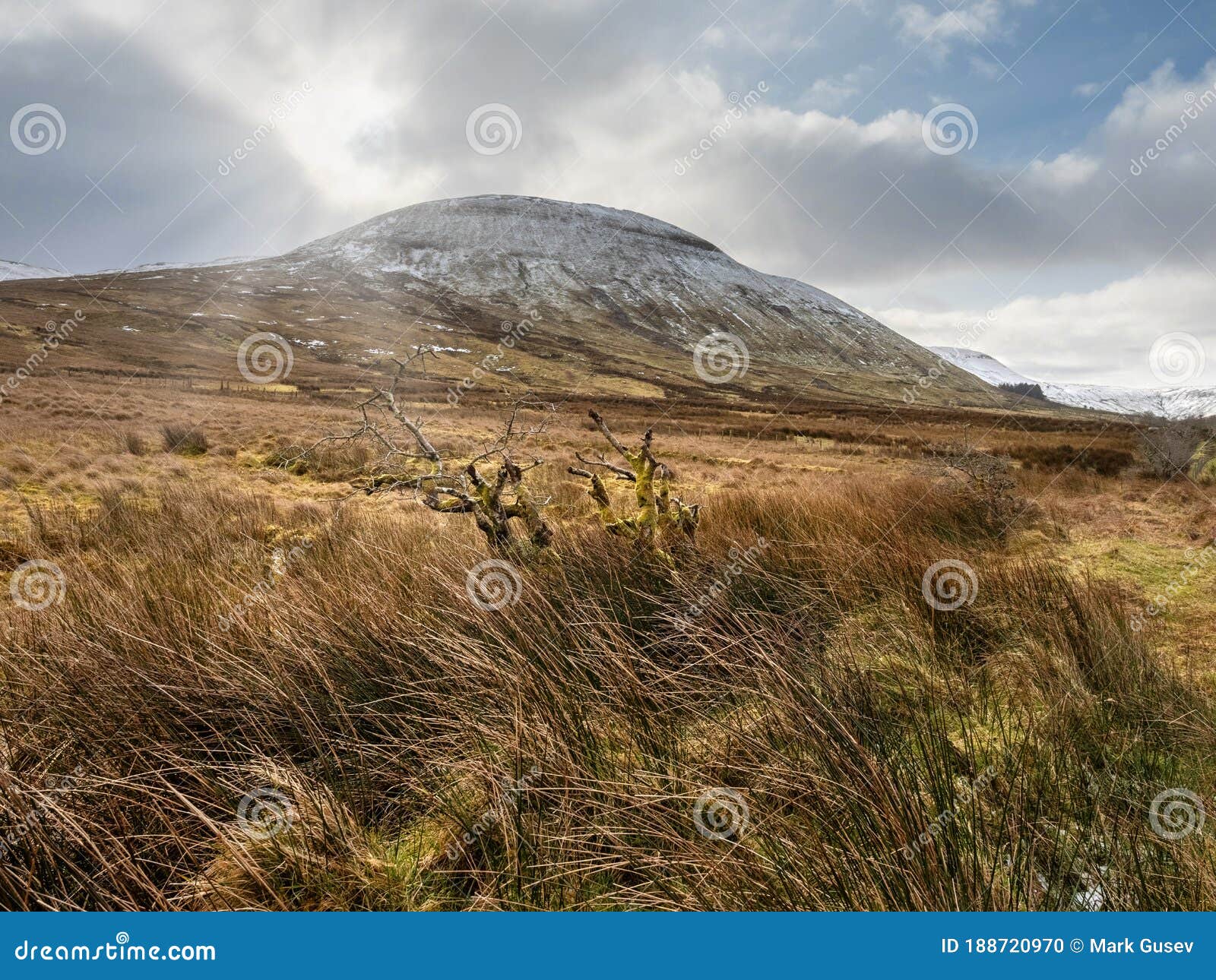 mountains in county sligo, ireland. winter season, peak covered with snow.