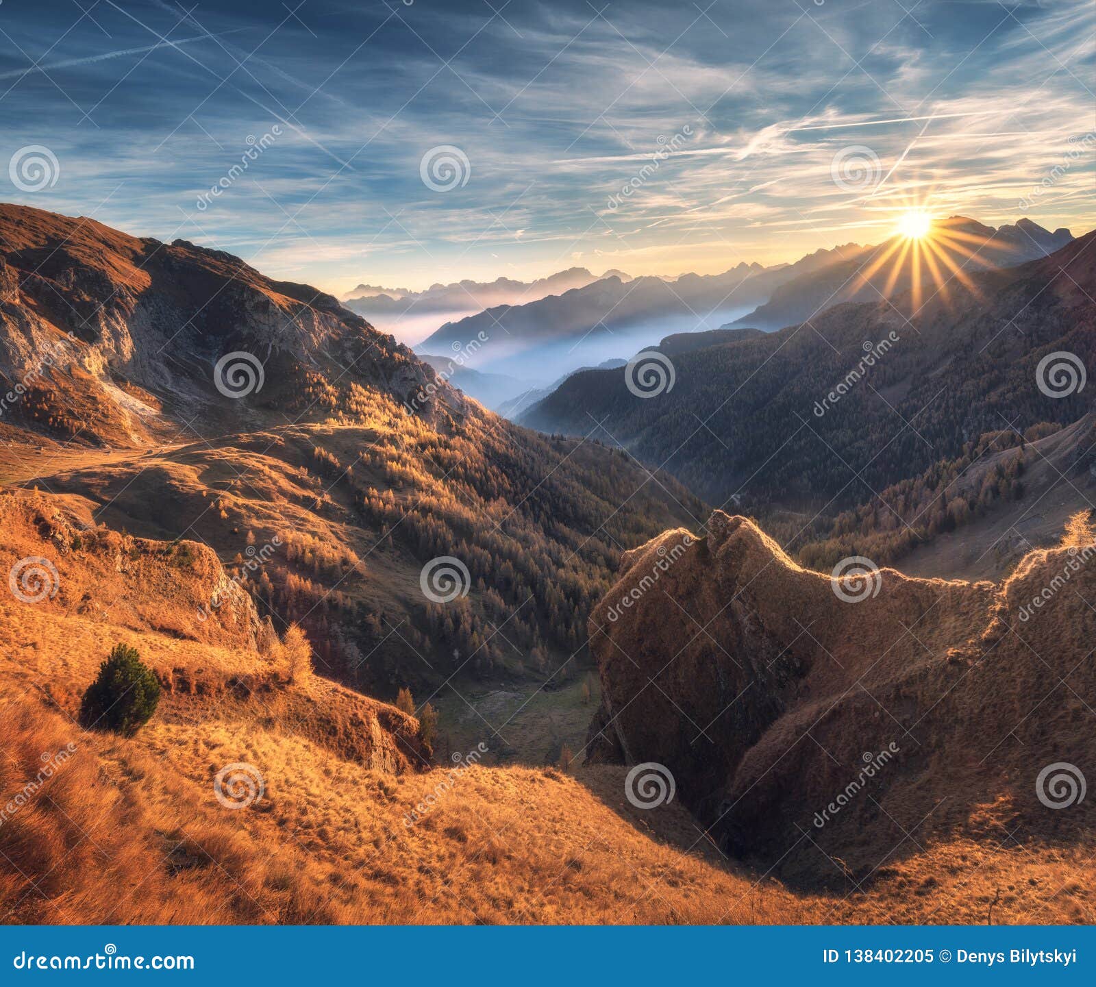 Mountains in Fog at Beautiful Sunset in Autumn. Dolomites, Italy Stock ...