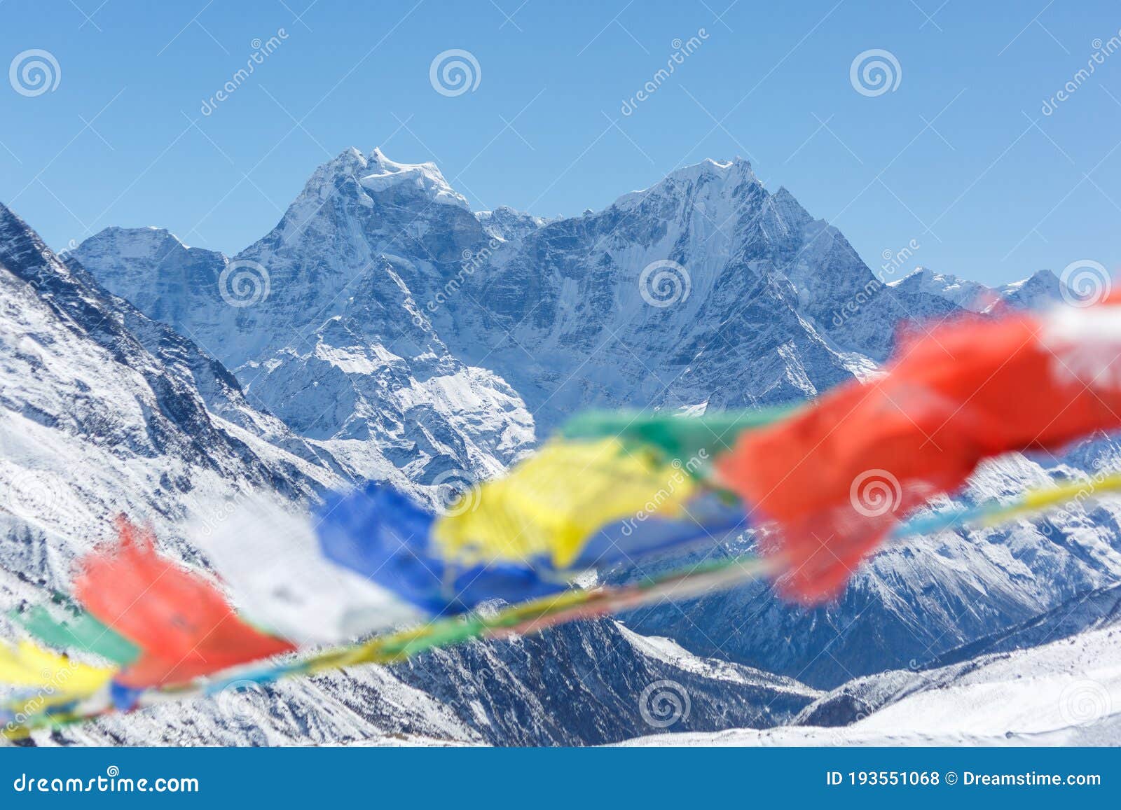 mountains of nepal. everest base camp trek. the foreground of the flags is blurred