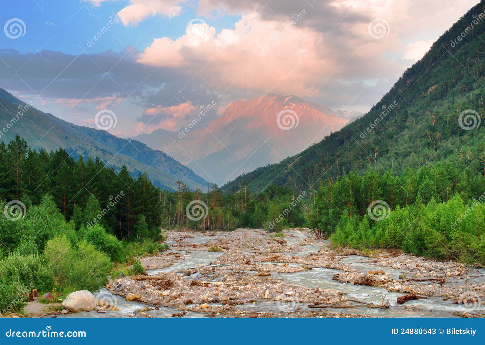 Mountains and river. High hill and the river in a mountain valley. Fresh spring composition