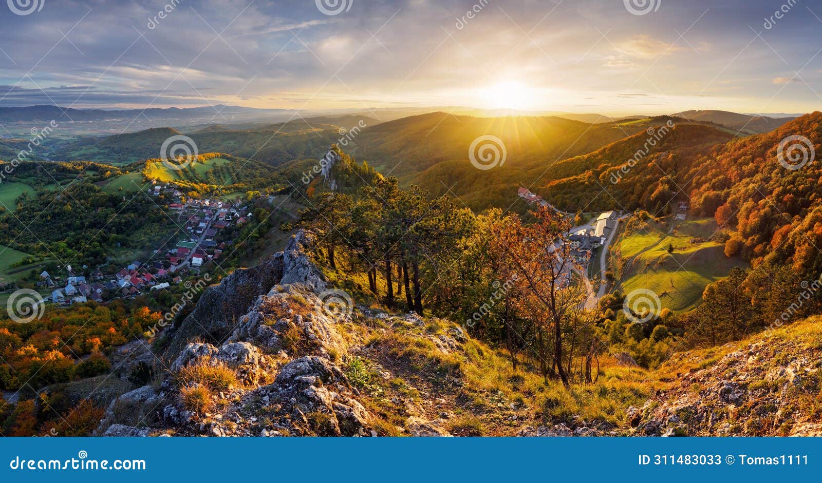 mountains at sunset in slovakia - vrsatec. landscape with mountain hills orange trees and grass in fall, colorful sky with golden