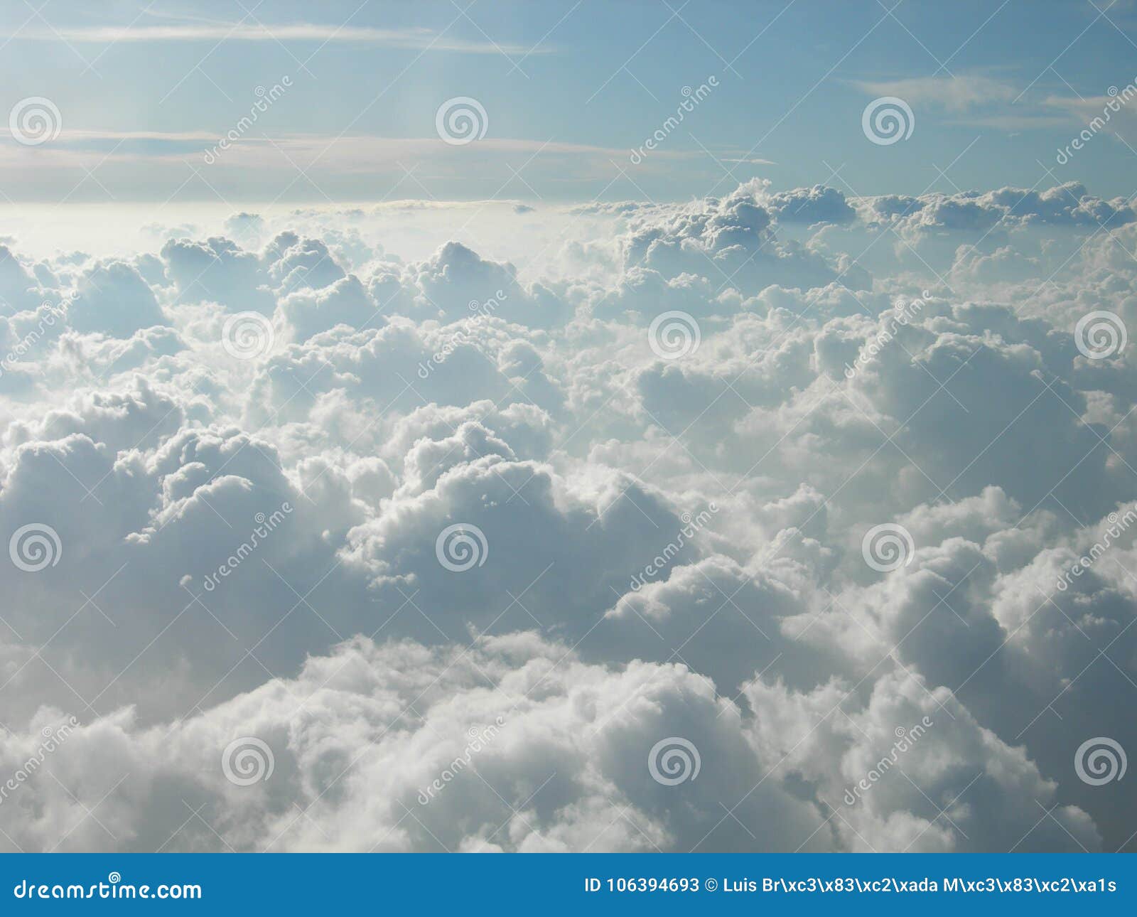 flying over cotton-like clouds. mountains of white clouds touching the sky