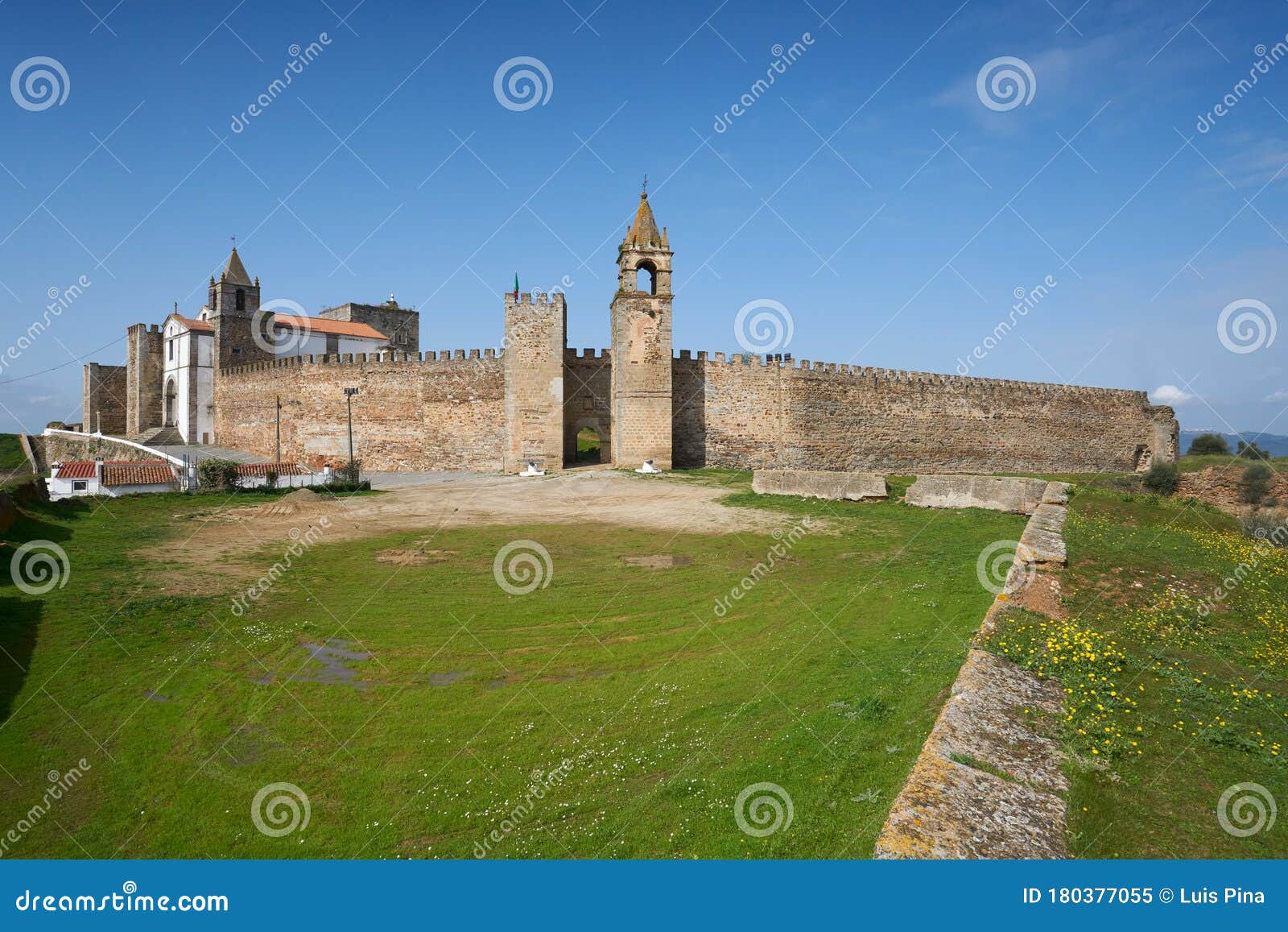 mourao castle facade entrance with tower in alentejo, portugal