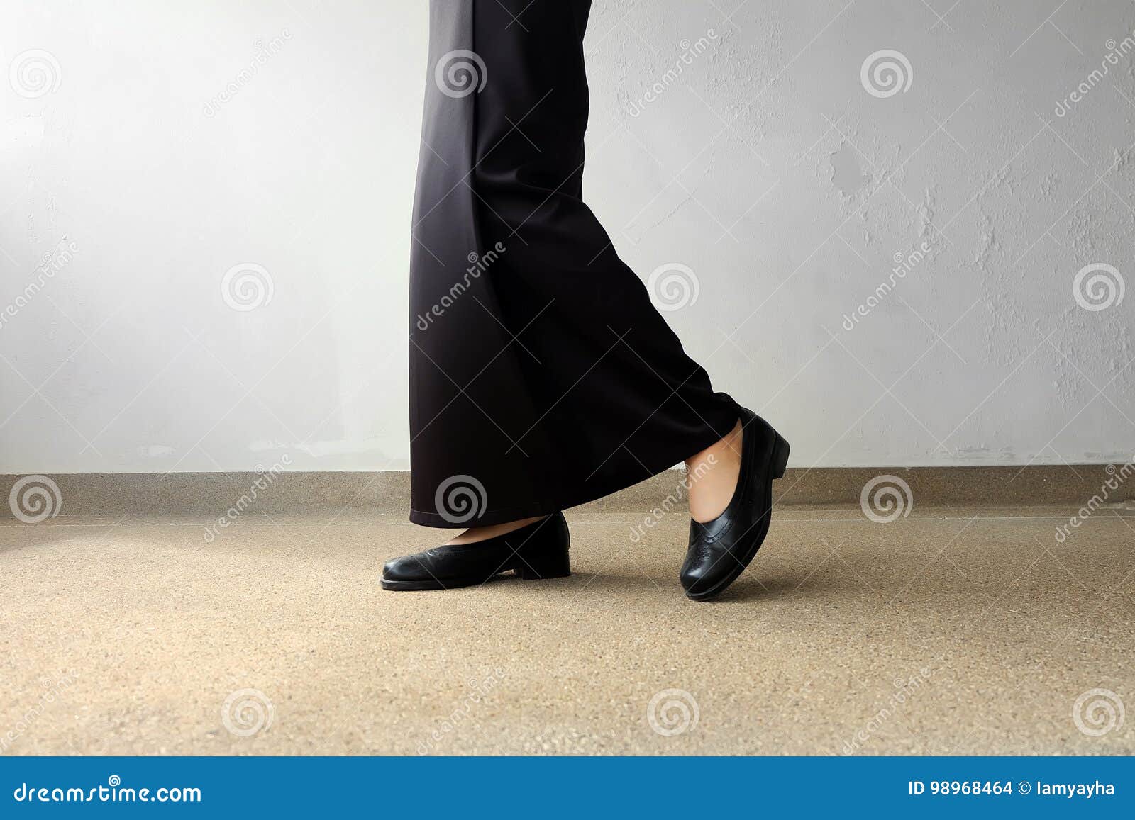 Mourning Feet Female in Black Flat Shoes and Black Dress Standing on ...