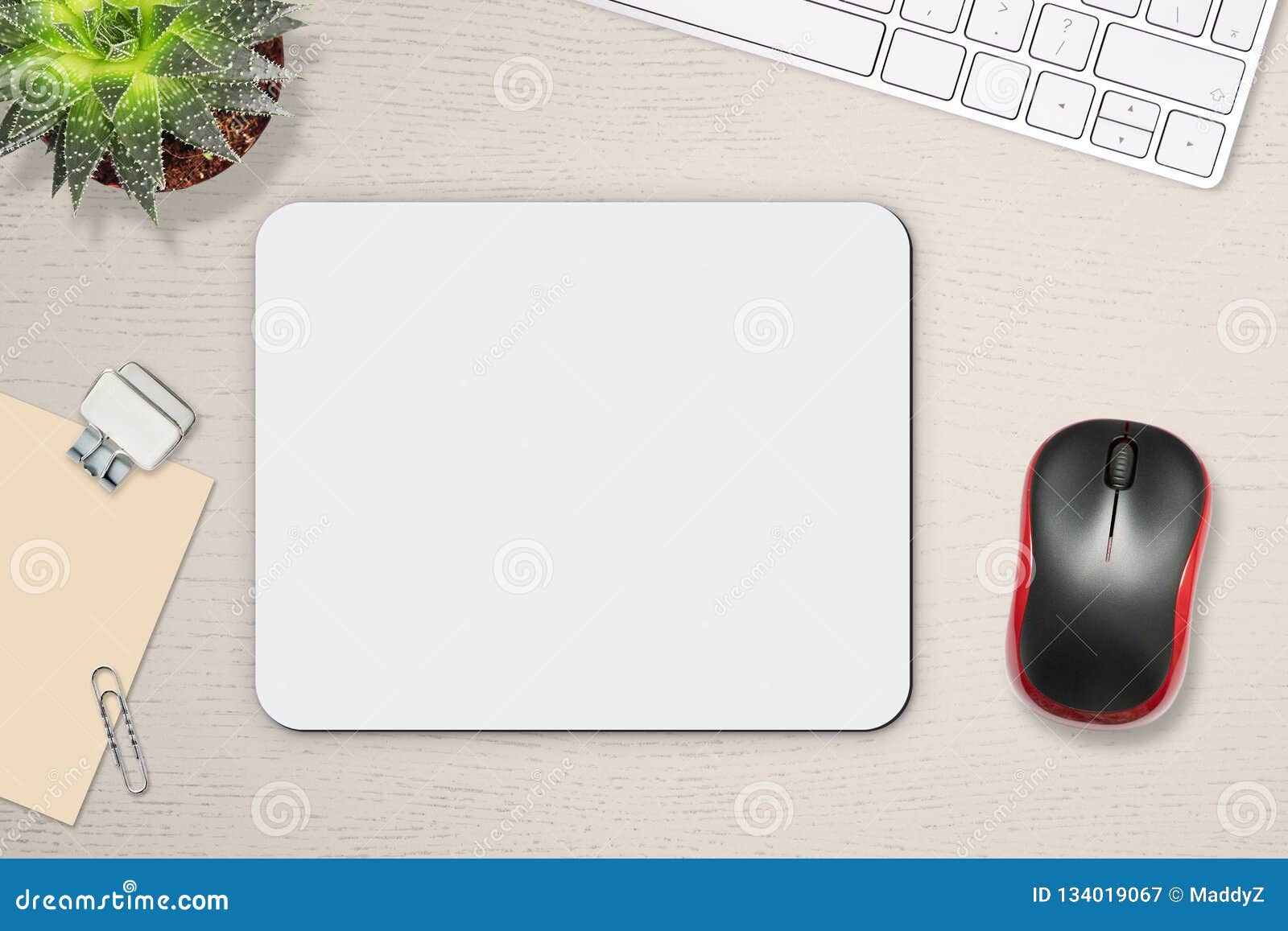 mouse pad mockup. white mat on the table with props, mouse and keyboard