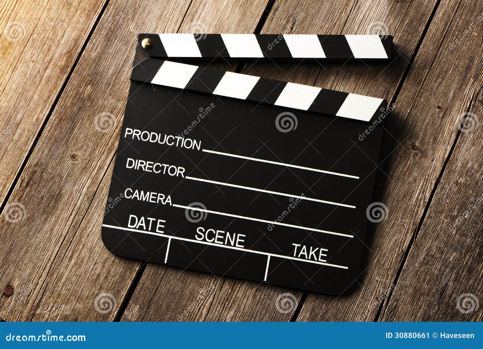 movie production clapper board over wooden background 30880661