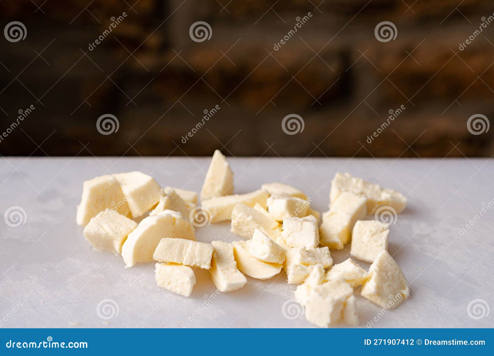 Mozzarella Cheese Diced on White Cutting Board Stock Photo Image of