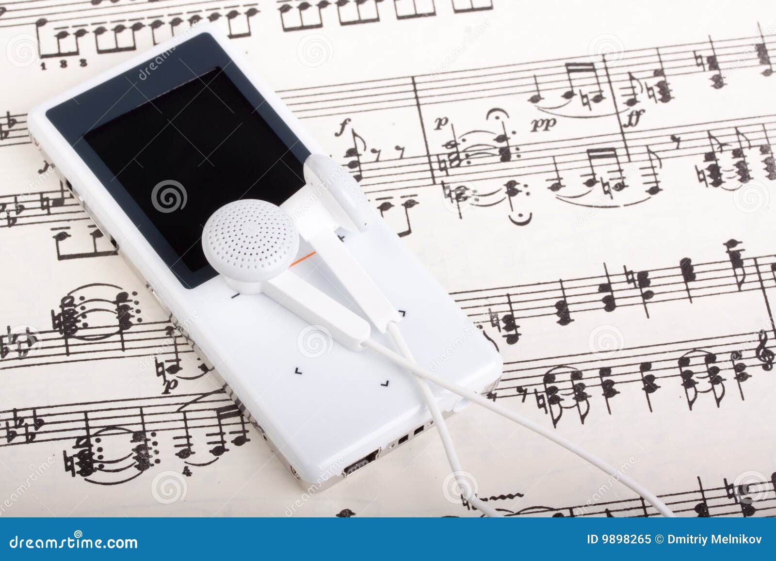 MP3 player and note stock image. Image of earbuds, device 9898265