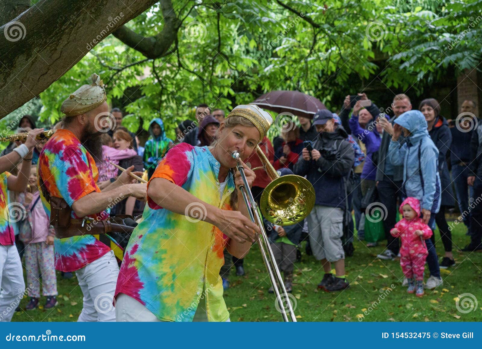 Mr Wilson S Second Liners Entertaining An Audience In The Rain