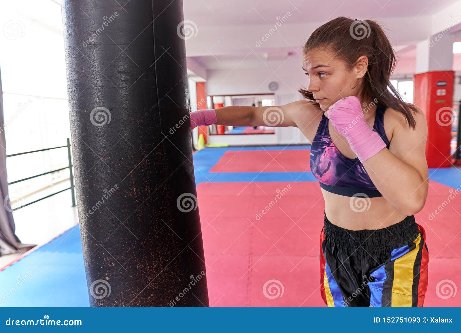 Muay Thai Girl Practicing with Heavy Bag Stock Image Image of