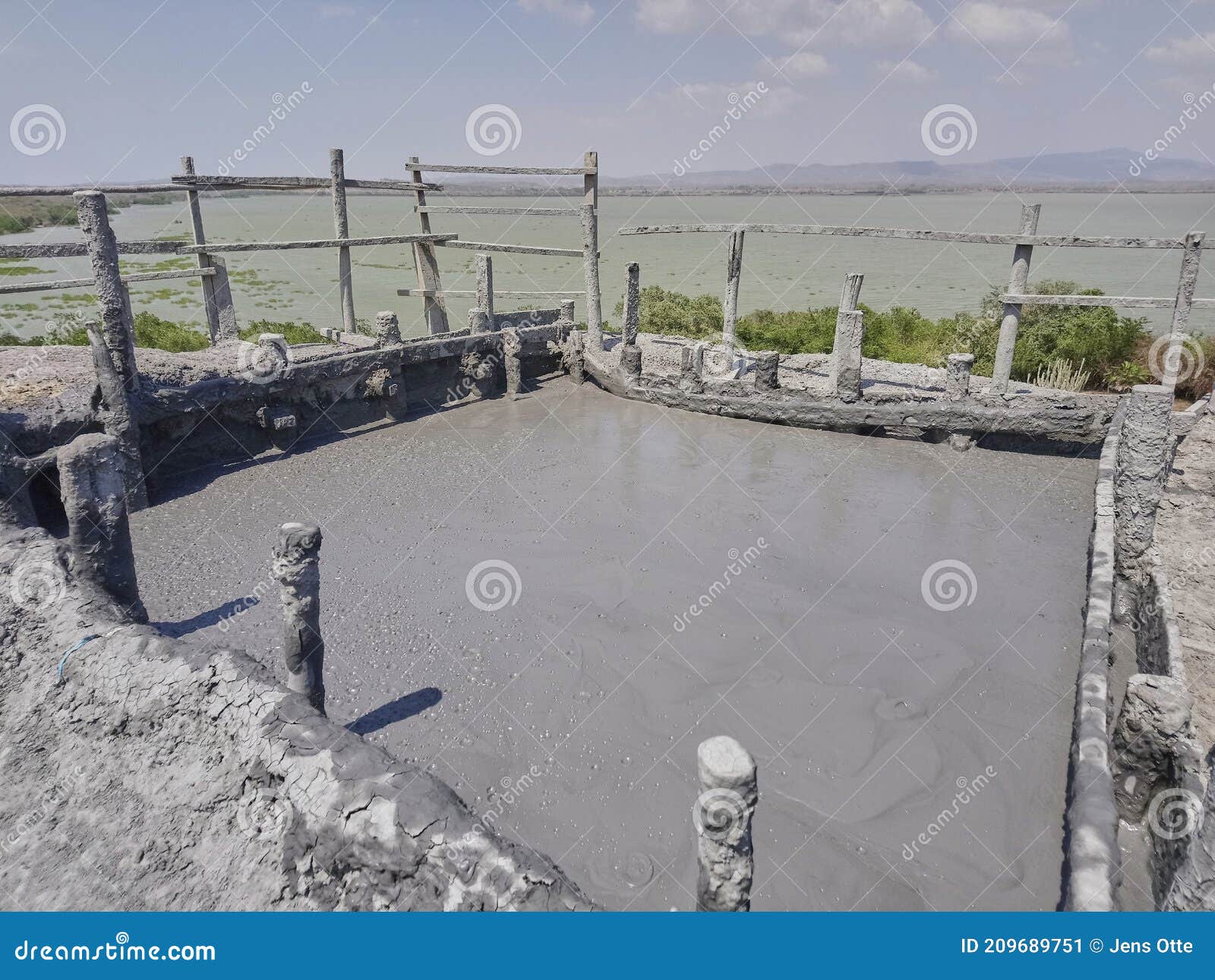 mud pool of volcano totumo close to cartagena in the tropics of colombia, is used as a wellness spa treatment by many tourists.