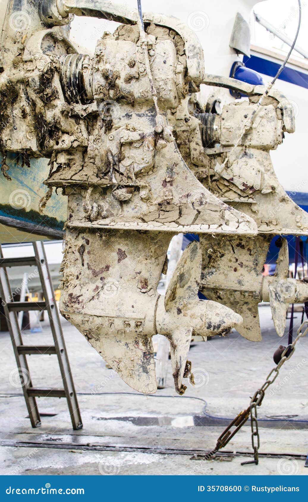 Muddy Outboard Motors stock photo. Image of weathered 