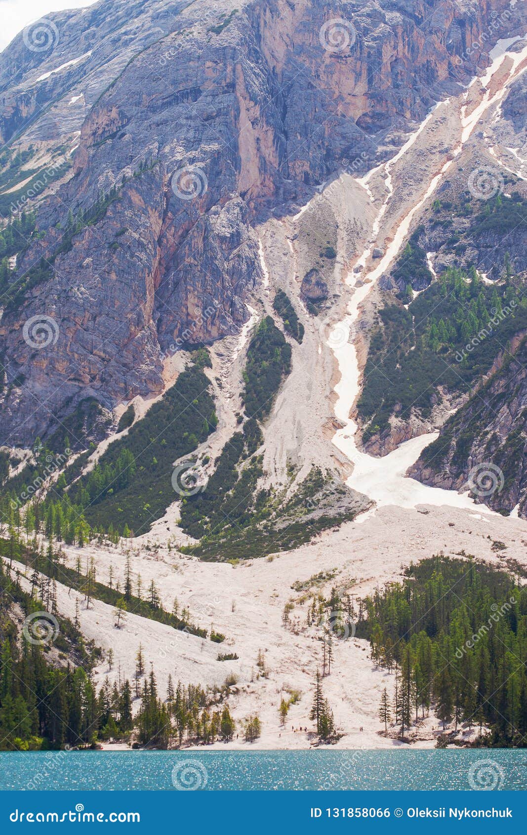 mudflow with snow high in the alpine mountains lake, lago di braies