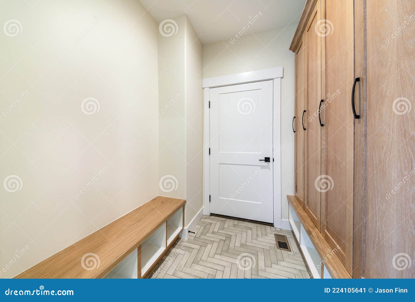 Mudroom Interior with Herringbone Tile Pattern Flooring and Wooden