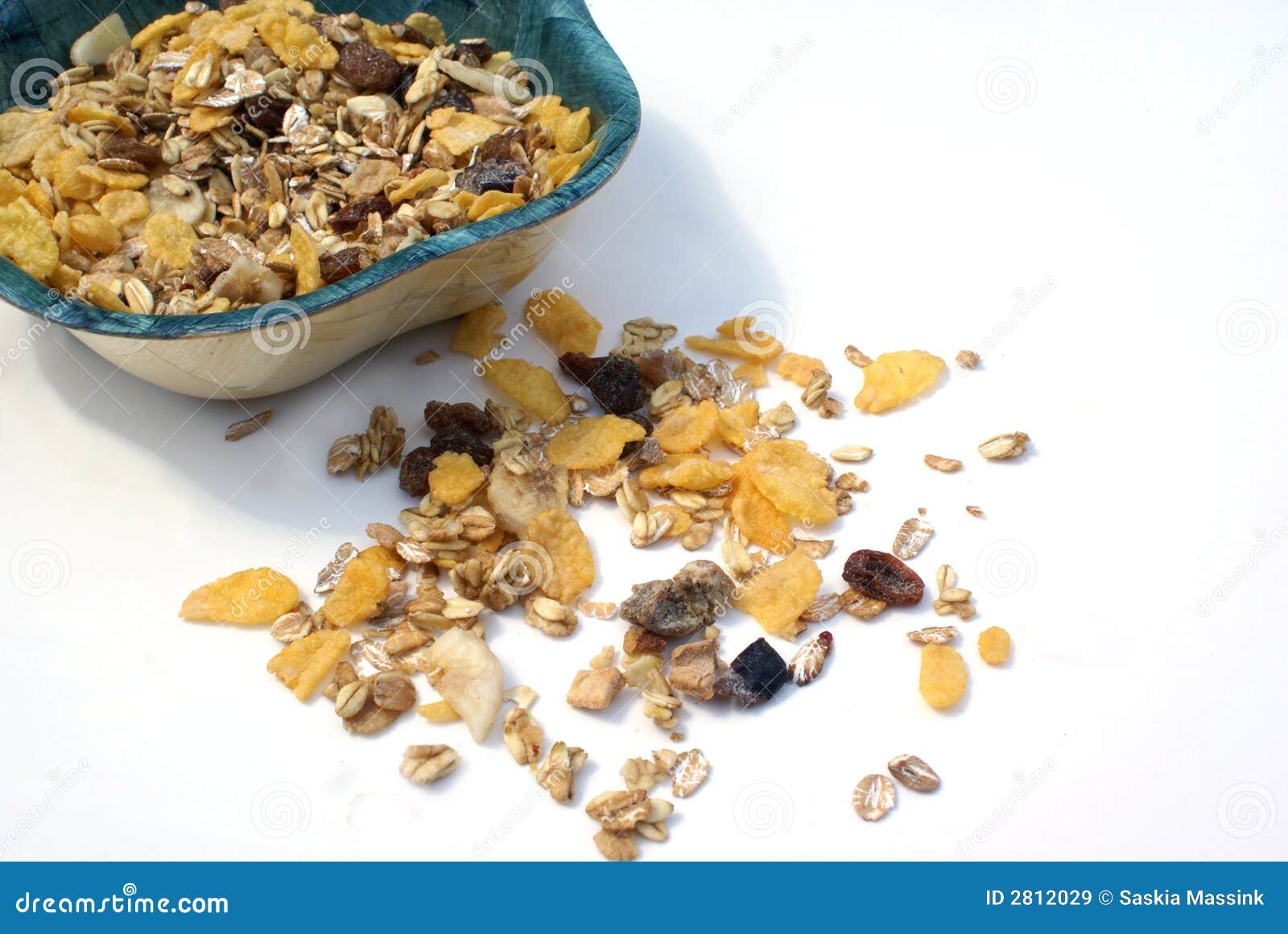 Muesli. Muesli in a bowl against a white background.